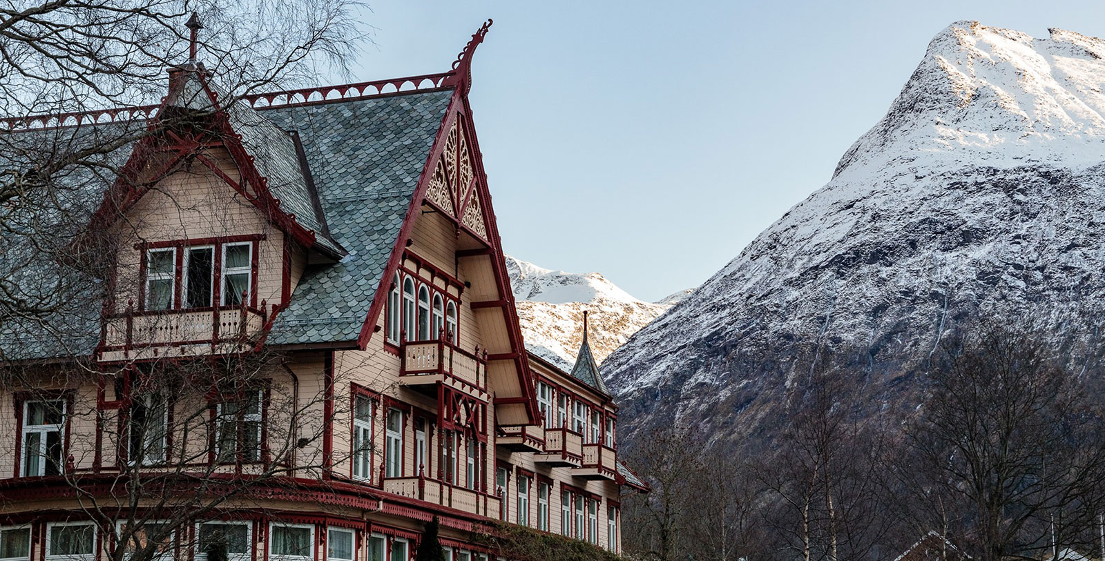a building with a mountain in the background