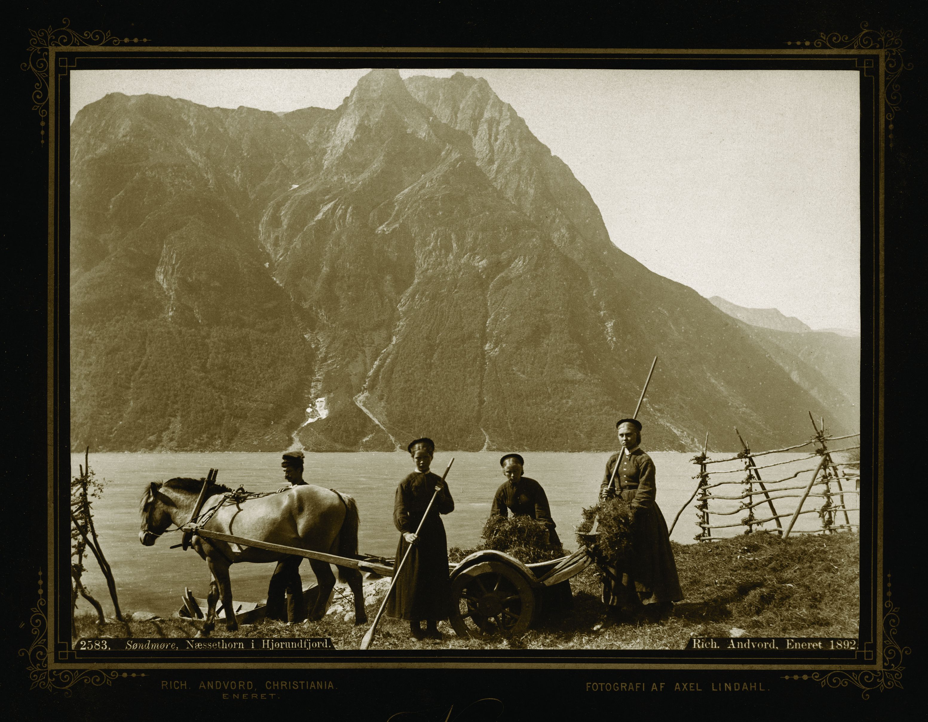 a group of men standing next to a horse cart