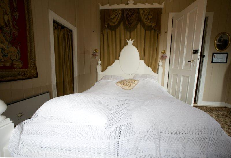 a bed with a white blanket