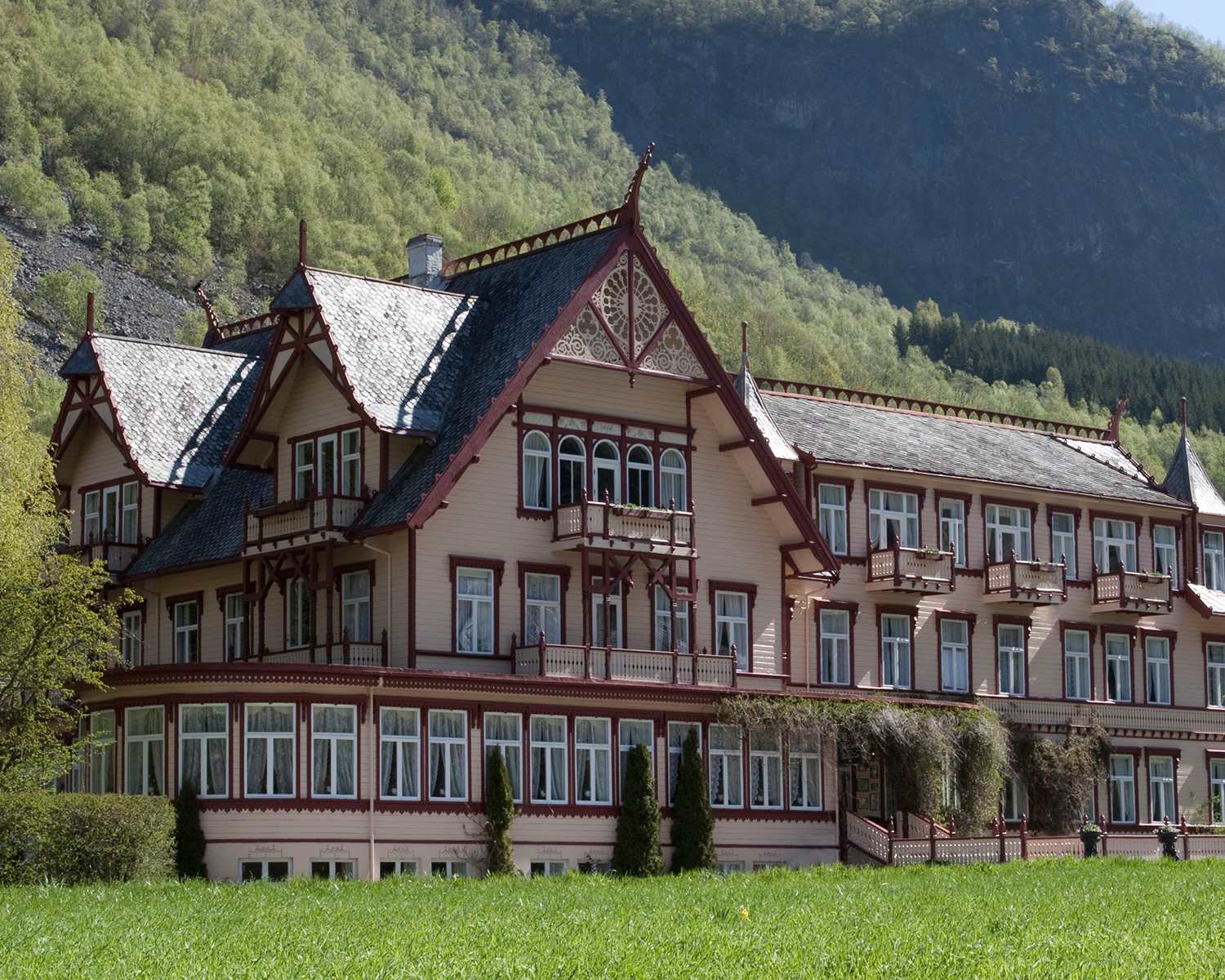 a large house with a lawn in front of it