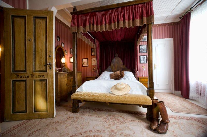a bed with a canopy and boots