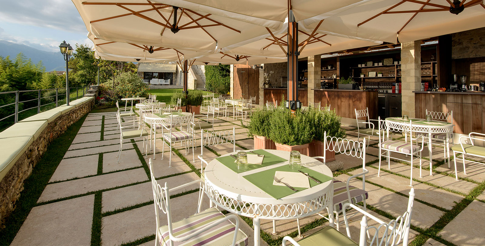 a patio with tables and chairs