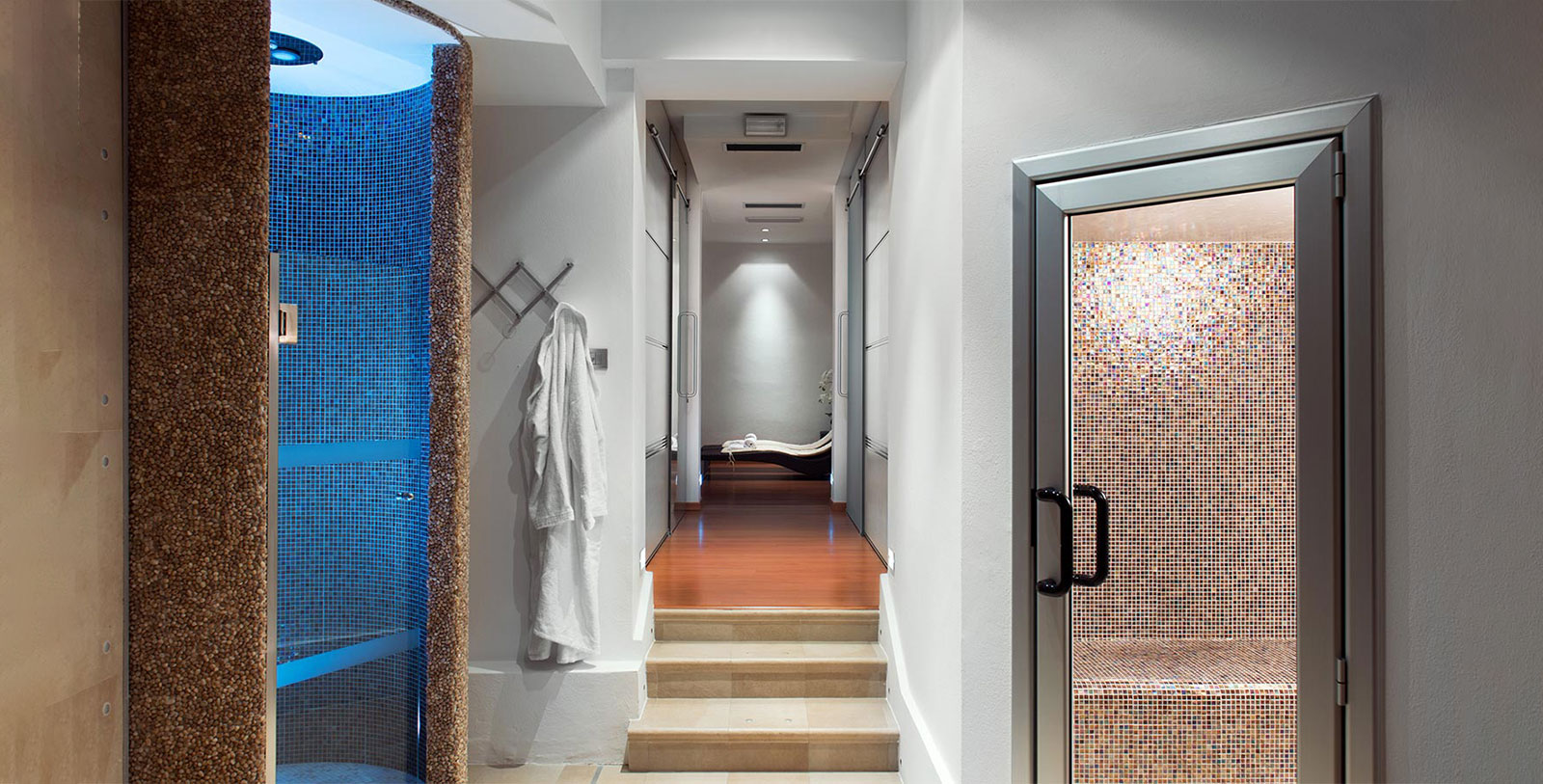 a hallway with a shower and a bathtub