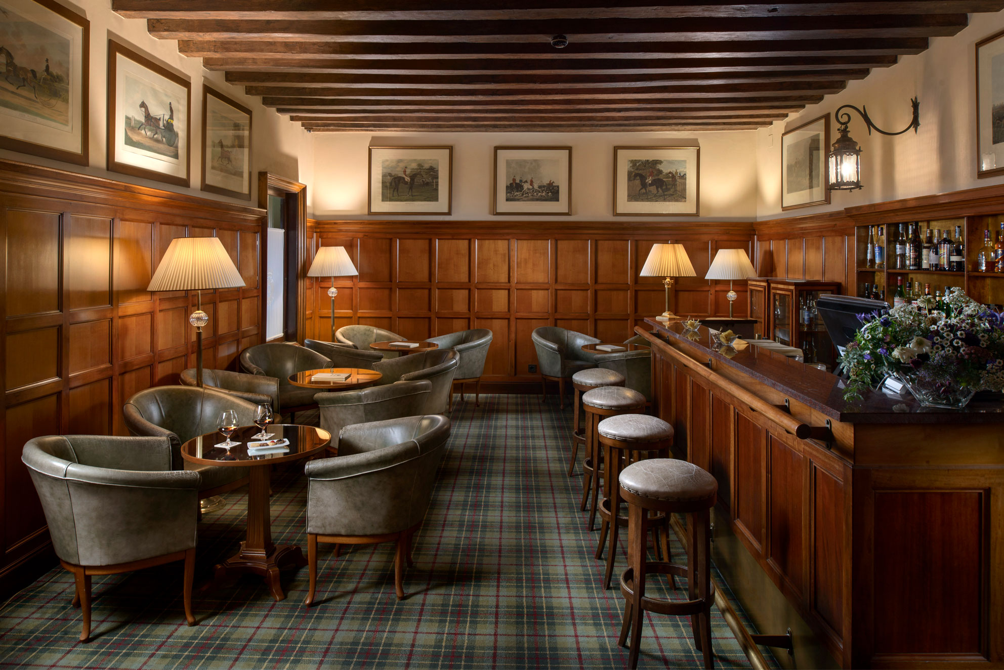 a room with a bar and chairs