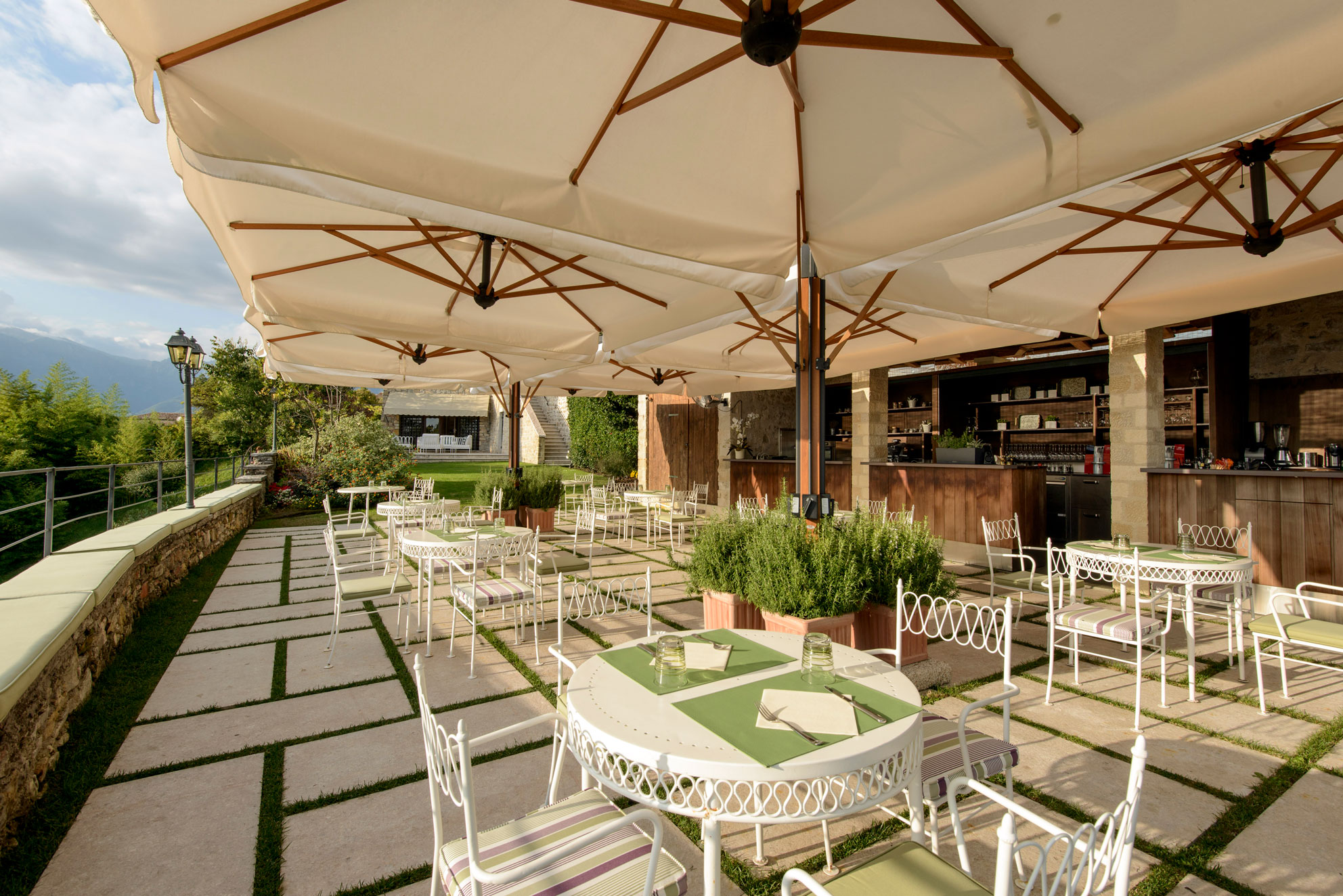 a patio with tables and chairs