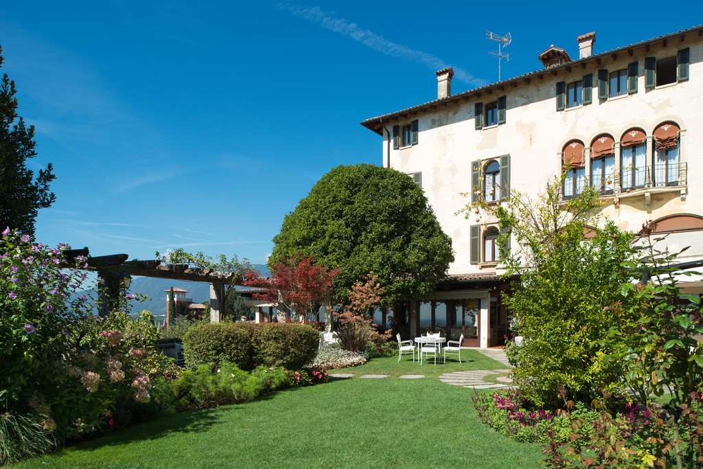 a house with a lawn and a patio
