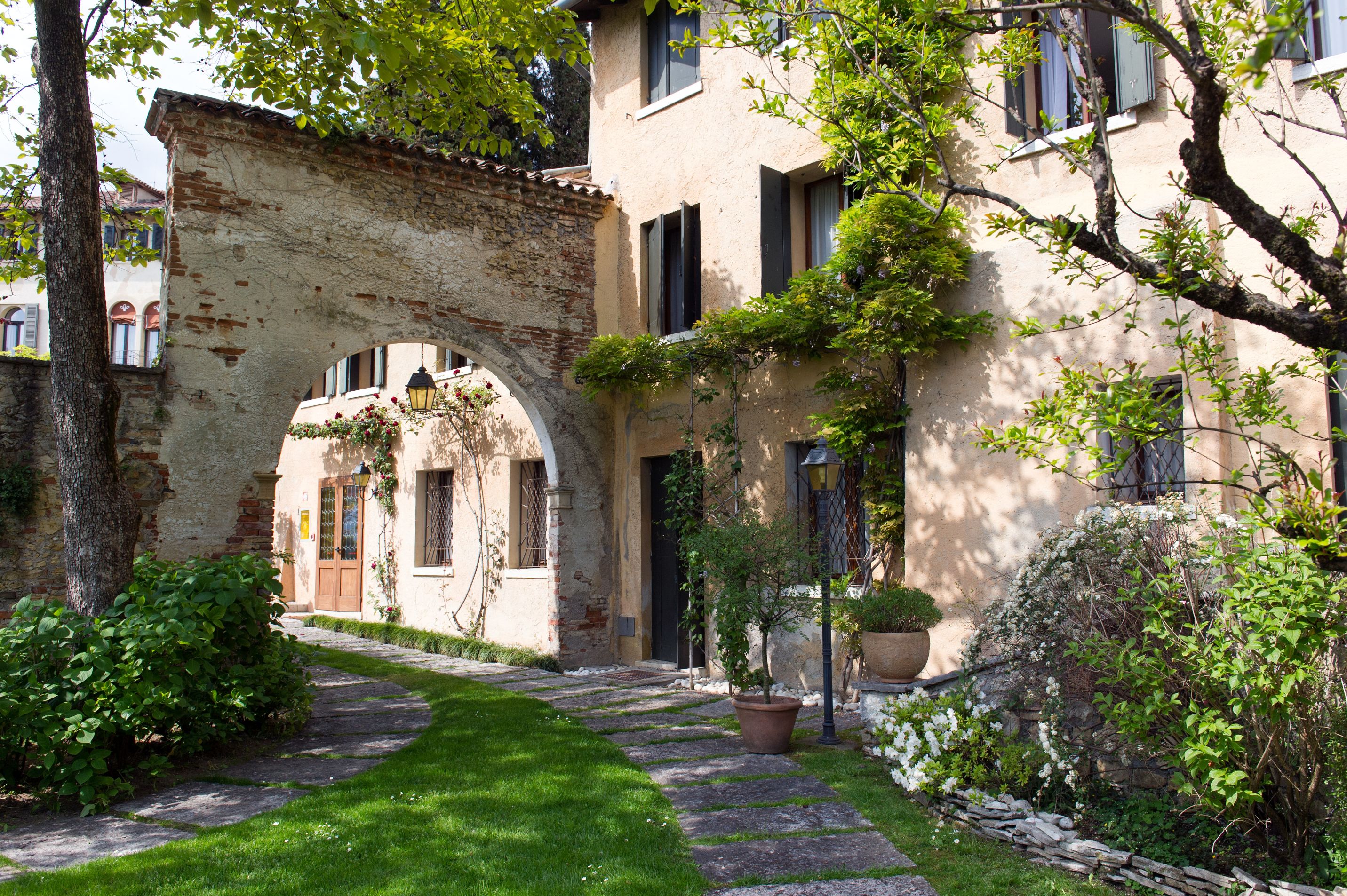 a stone walkway leading to a building