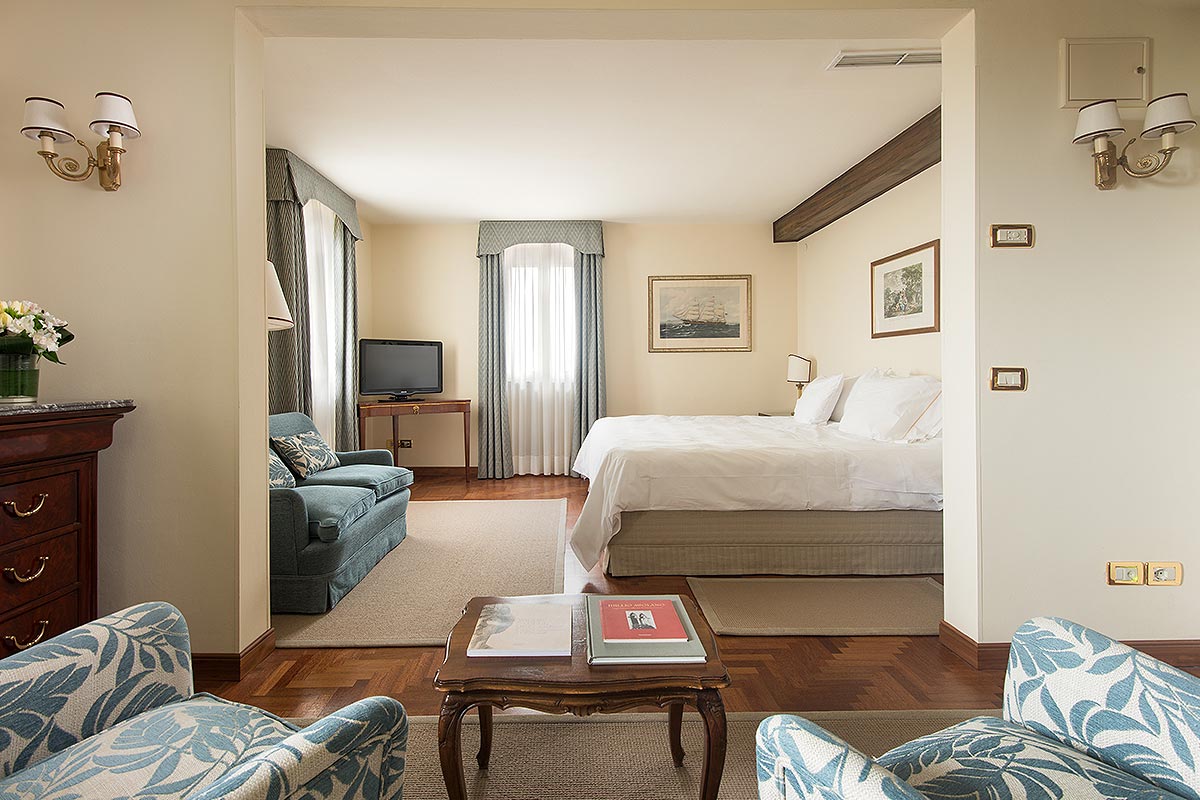 a bedroom with a bed and a couch