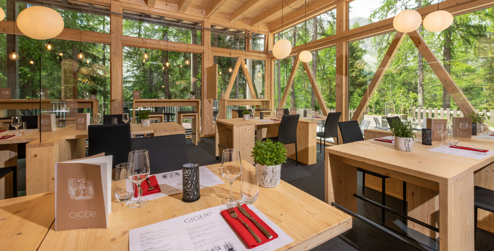 a room with tables and chairs and a window