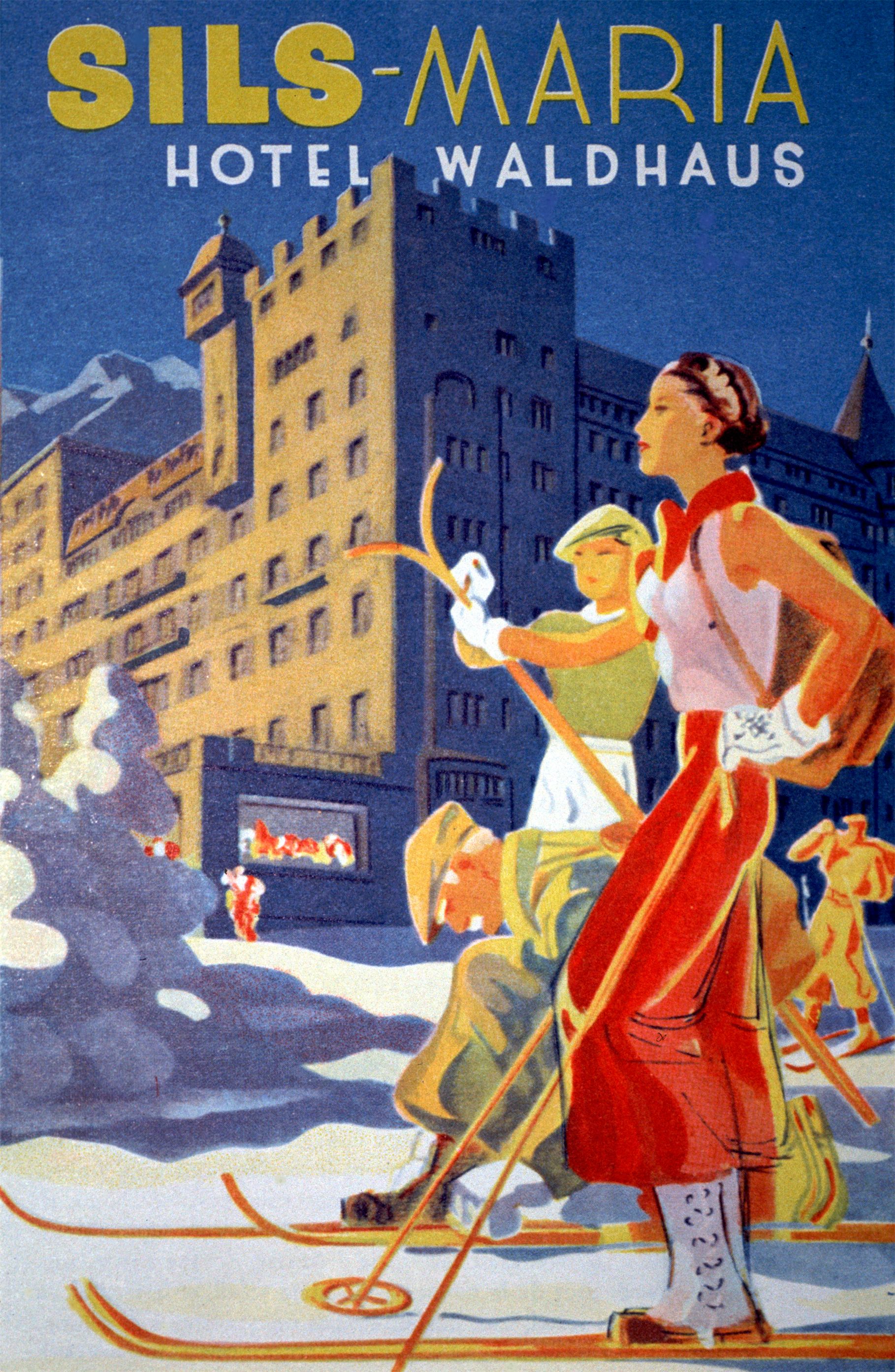 a woman and a man on a ski slope