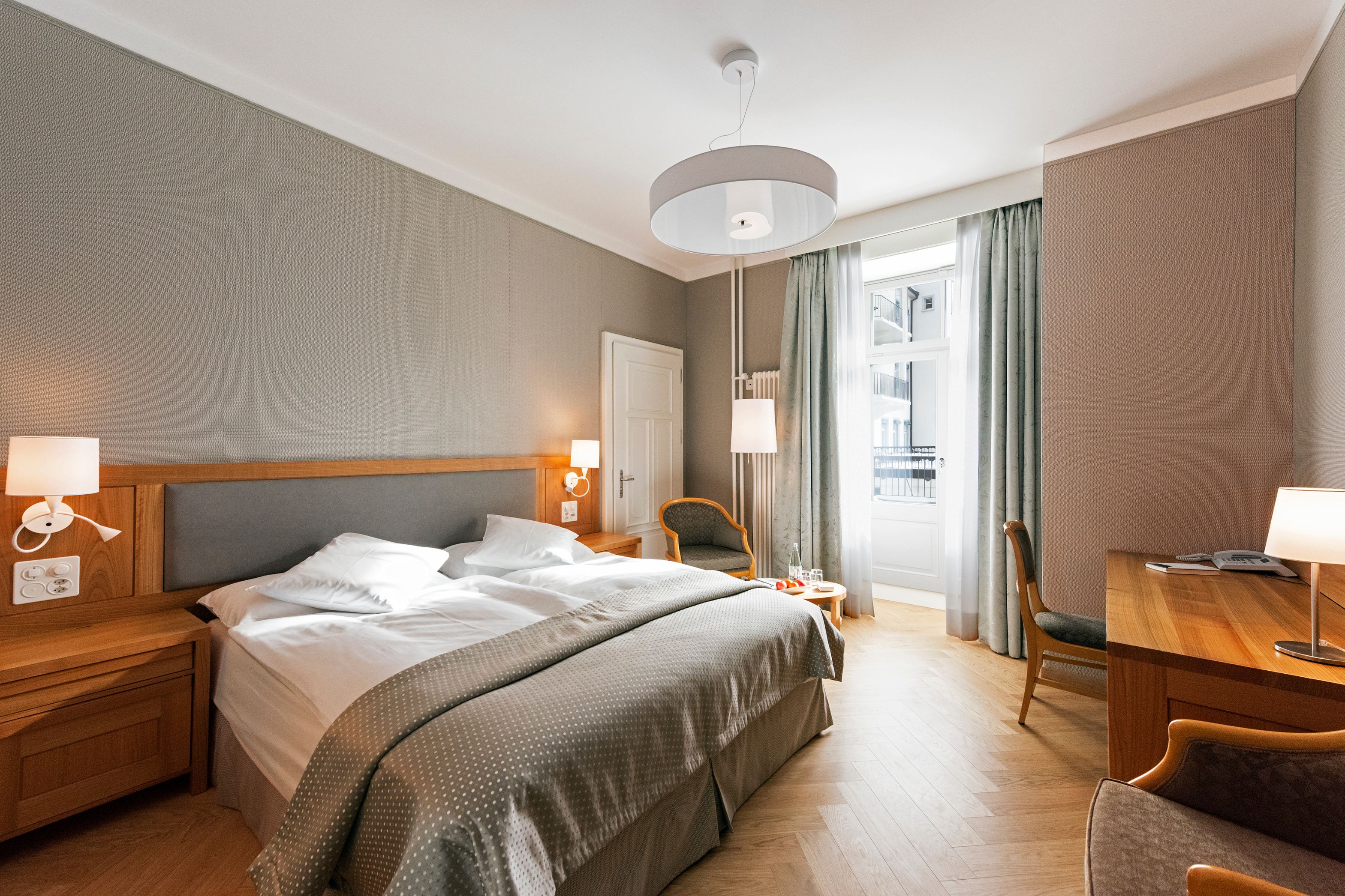 a bedroom with a bed and a chair