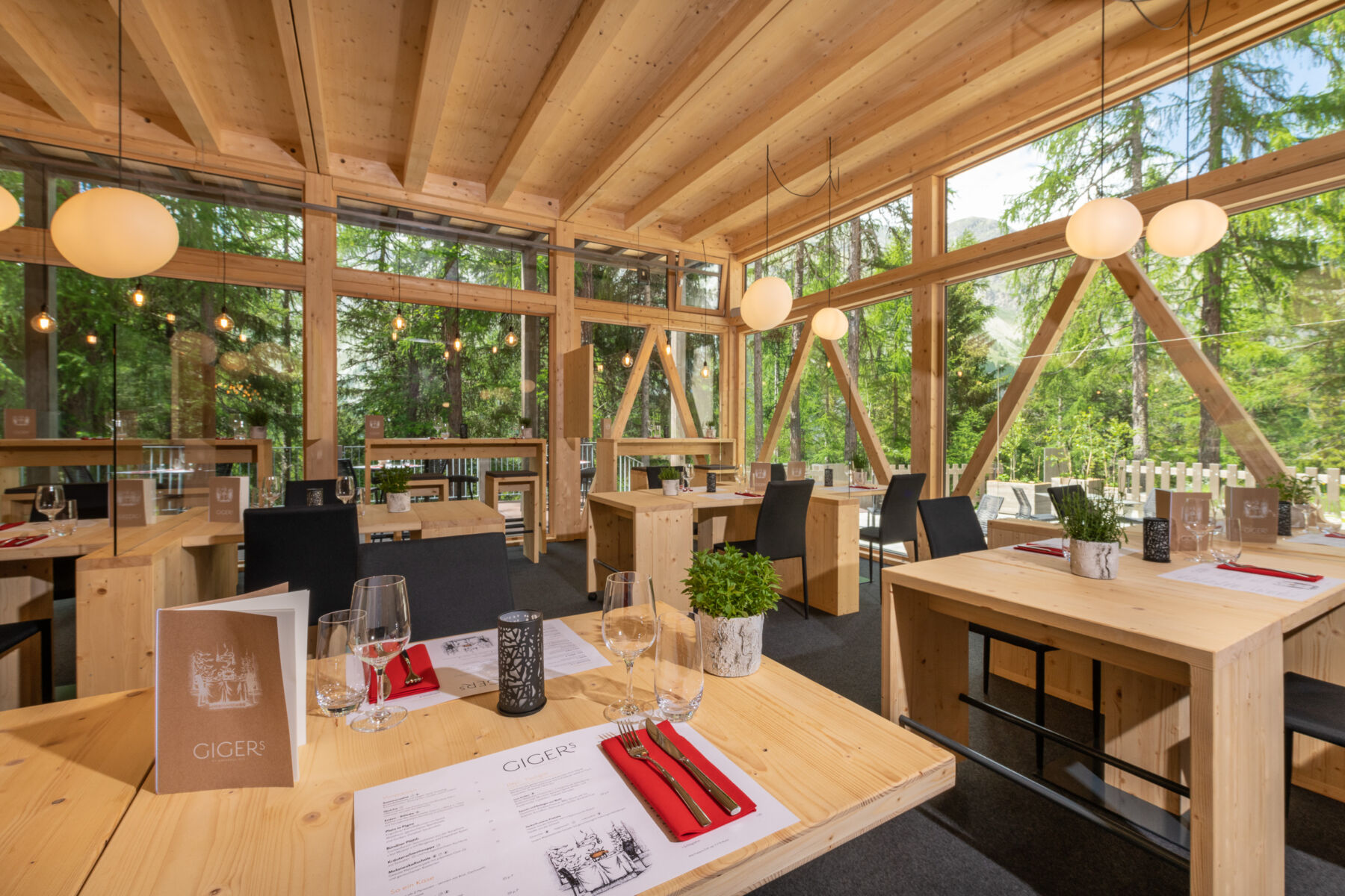 a room with tables and chairs and a window