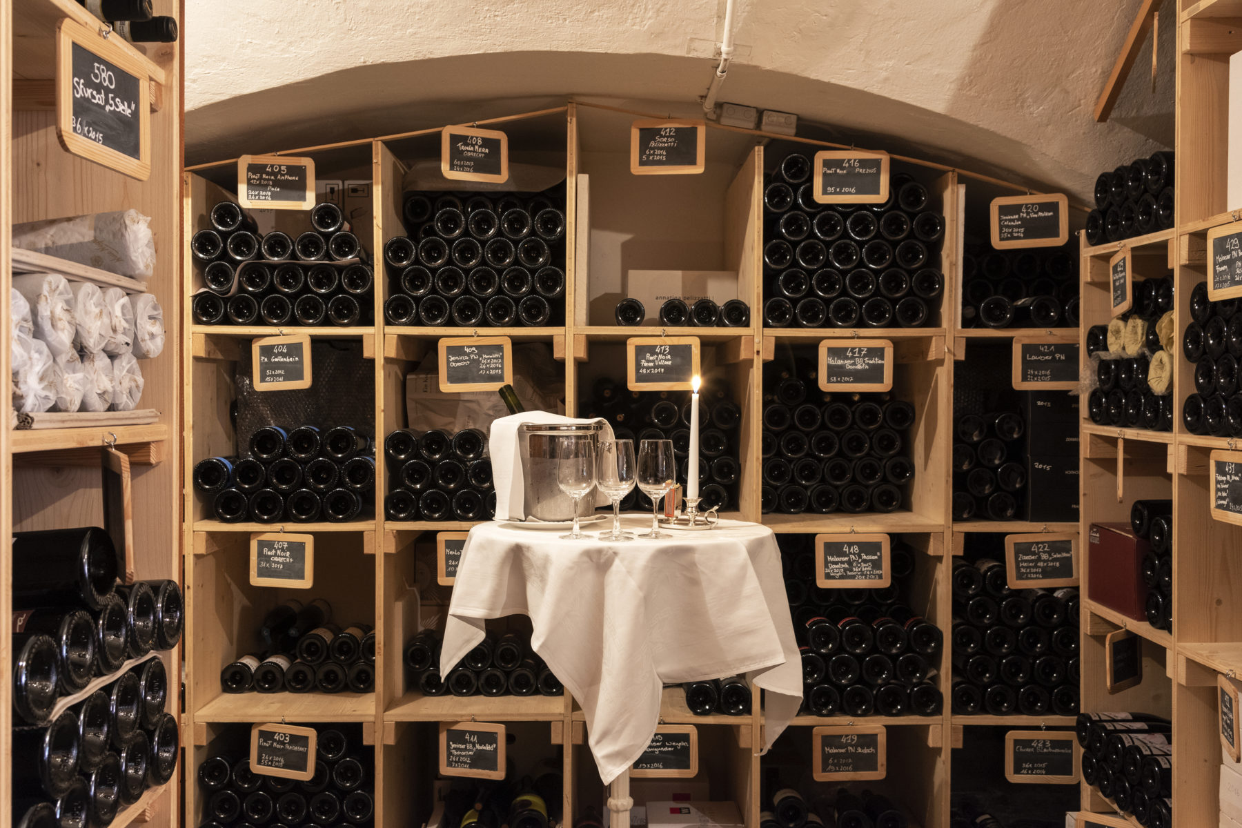 a wine bottles on shelves