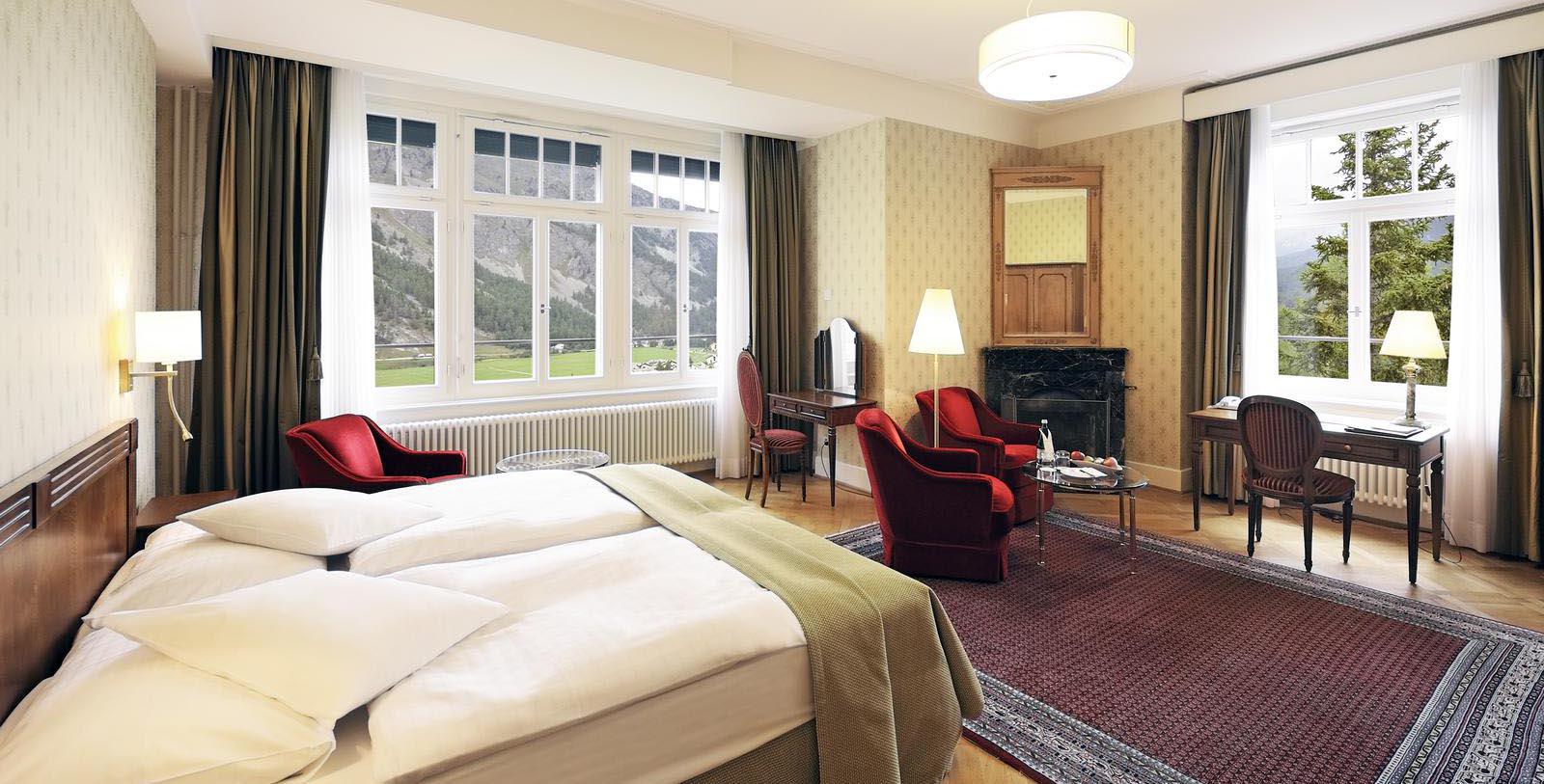 a room with a fireplace and a bed