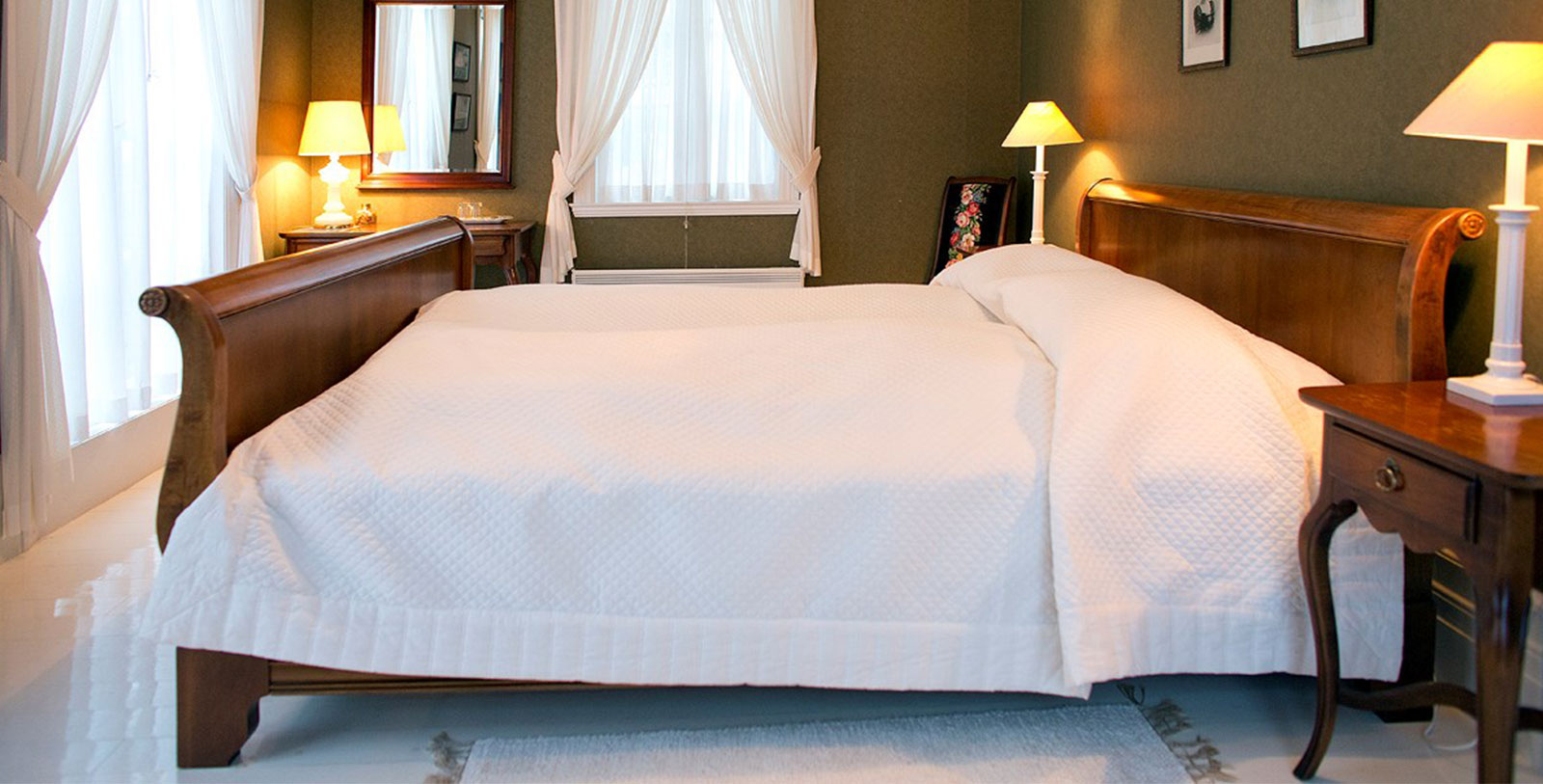 a bed with white sheets