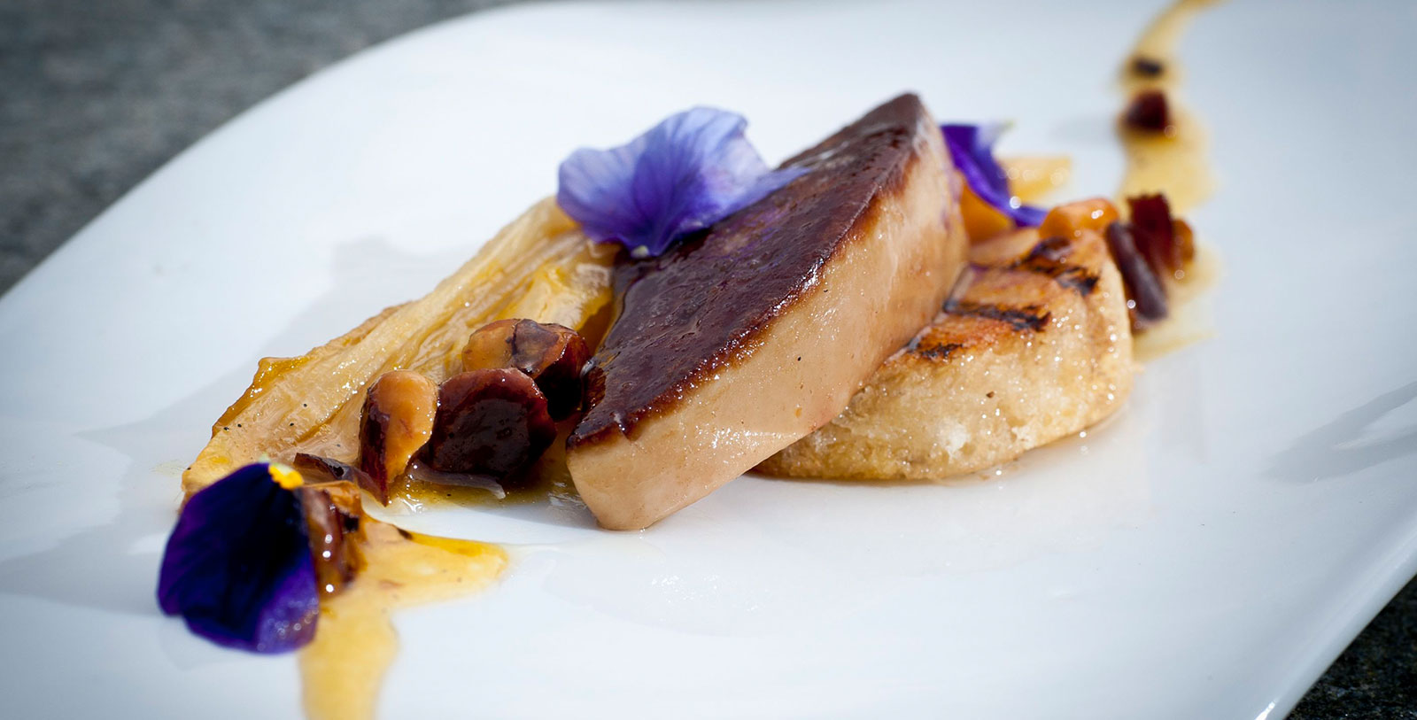 a plate of food with a flower on it