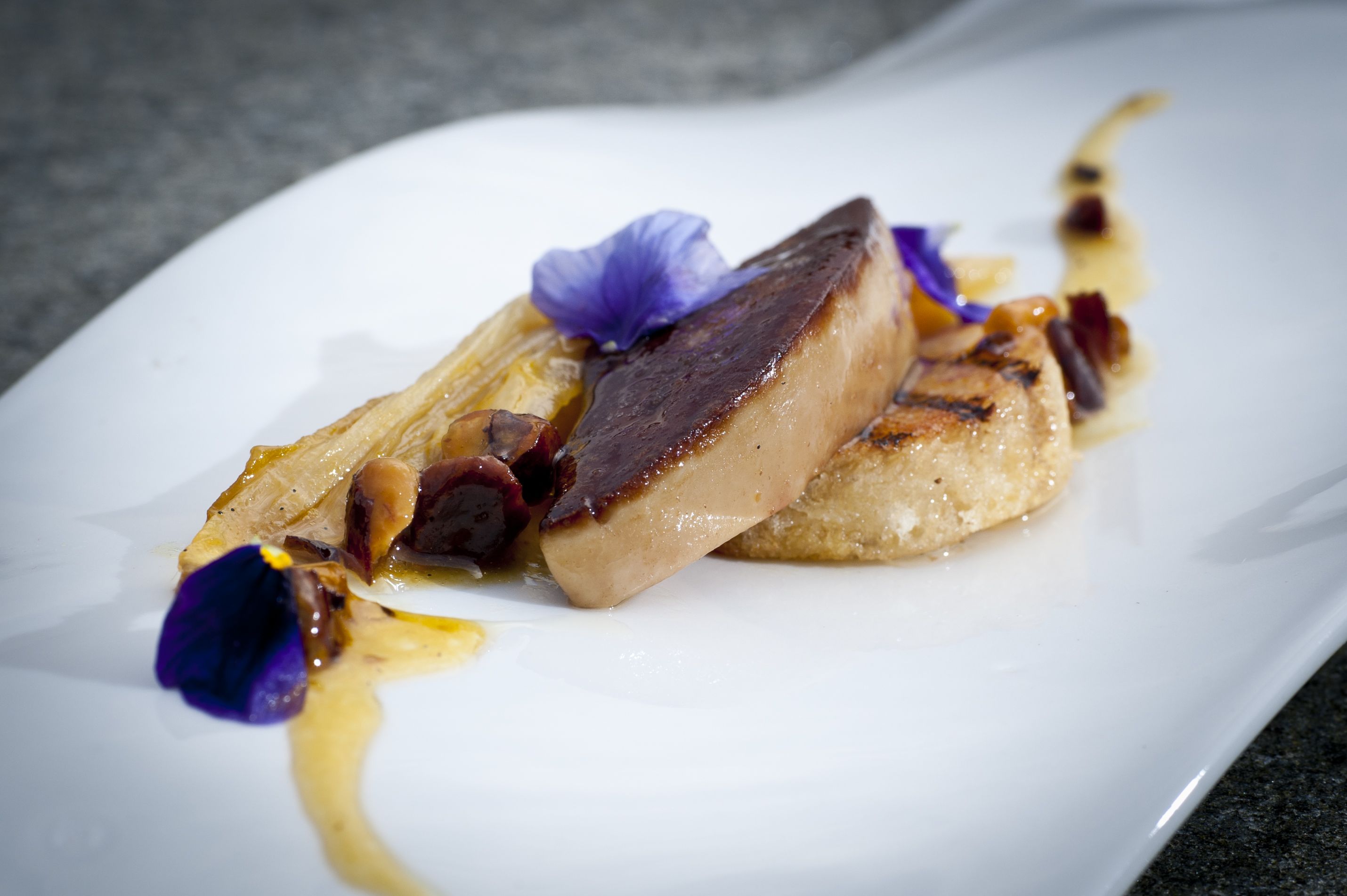 a plate of food with a flower on top