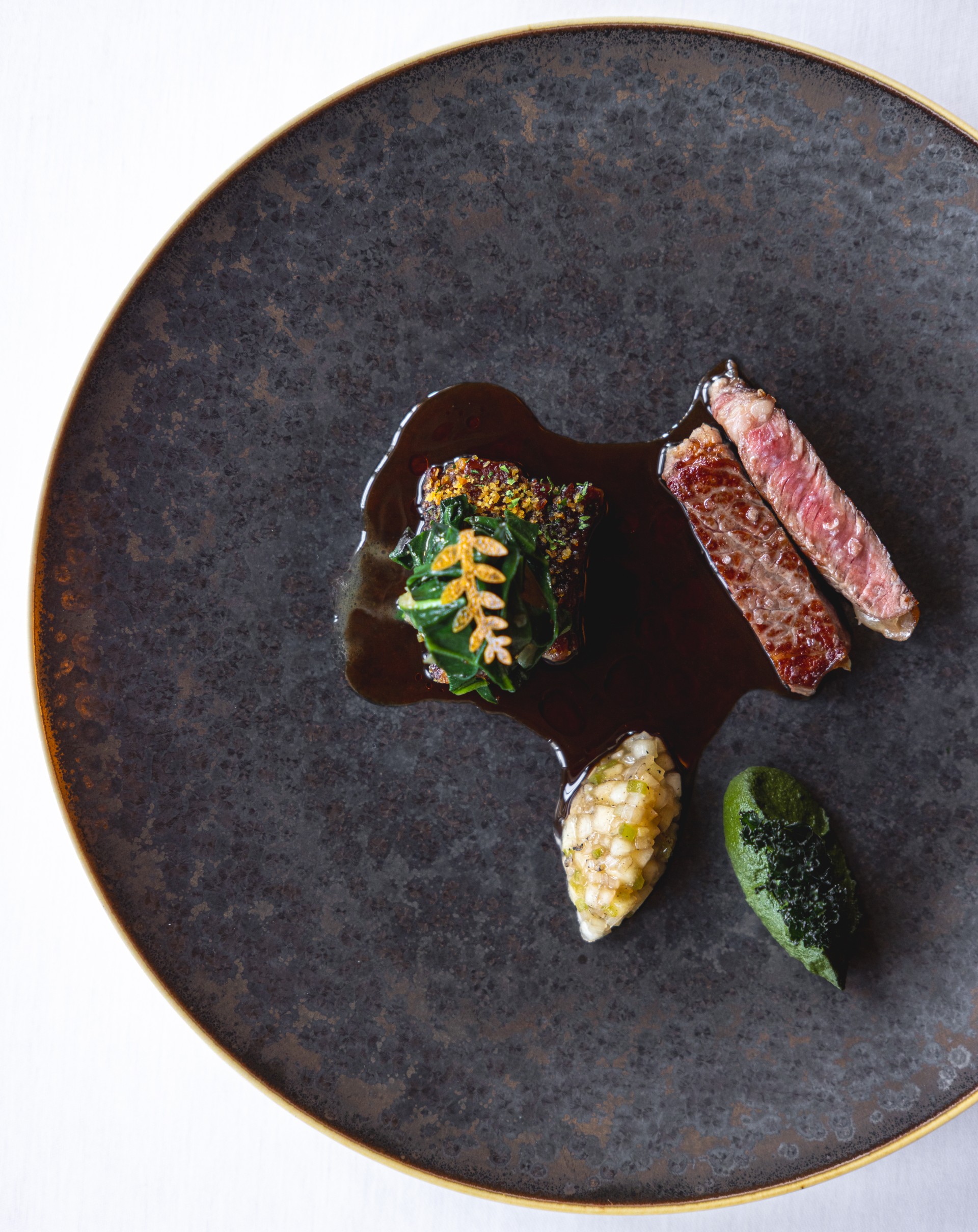 a plate of food on a white surface