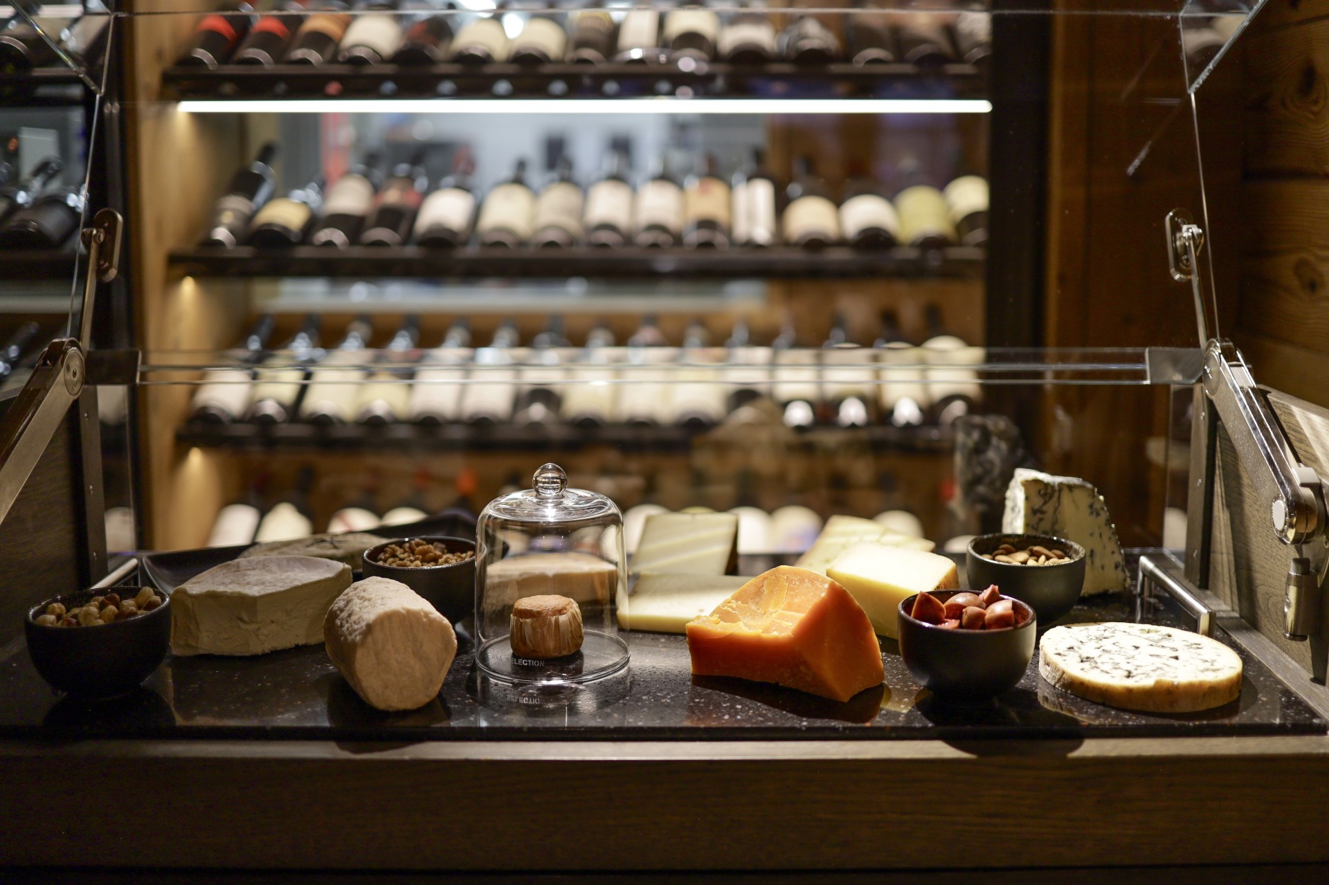 a display of cheeses and snacks