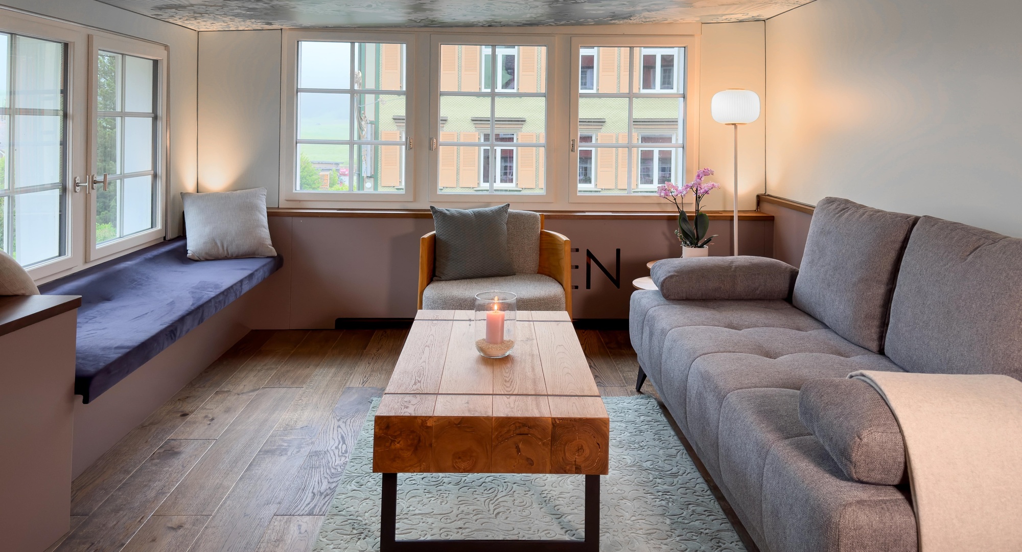 a living room with a couch and a table