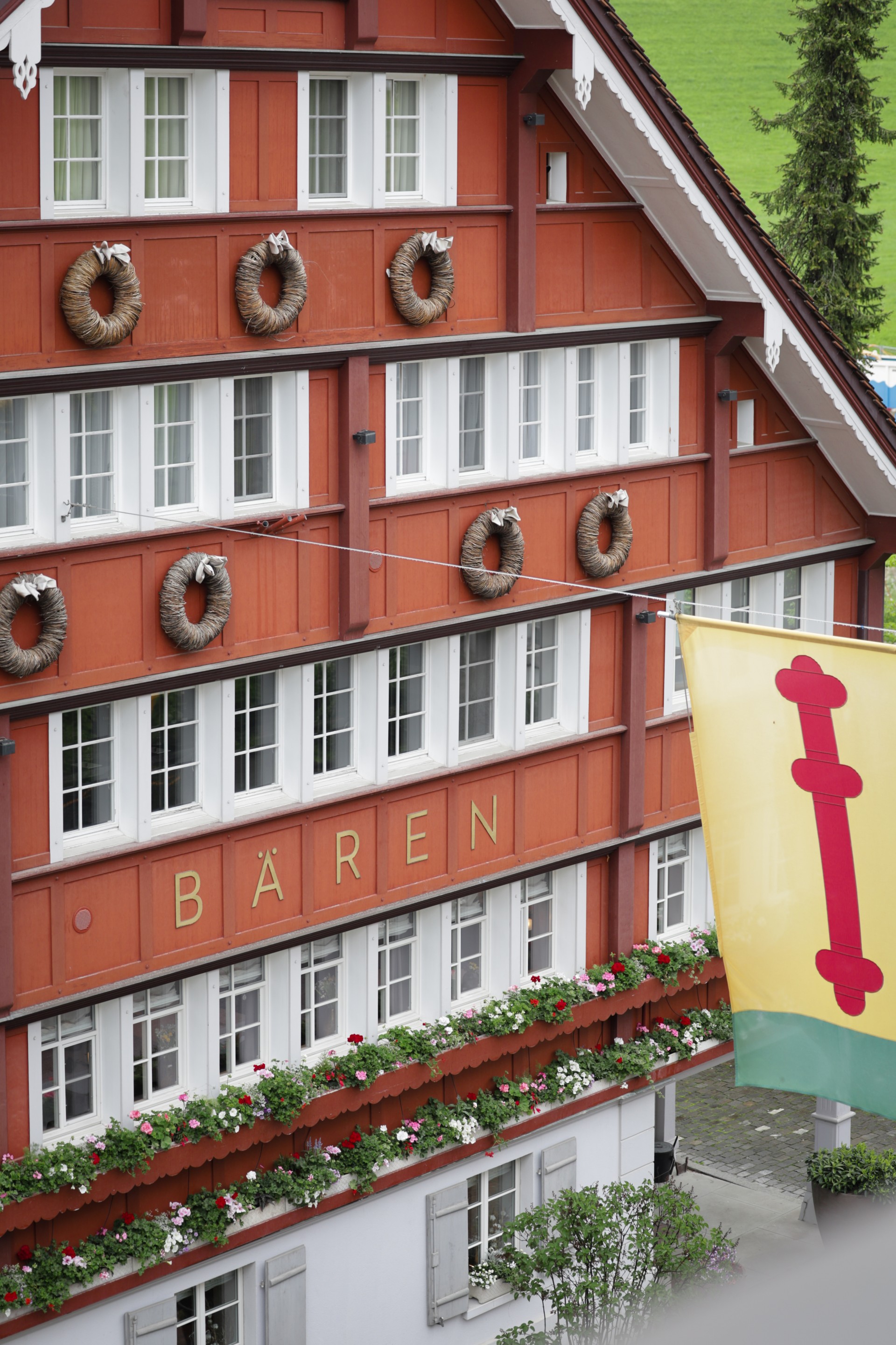 a building with wreaths on the side