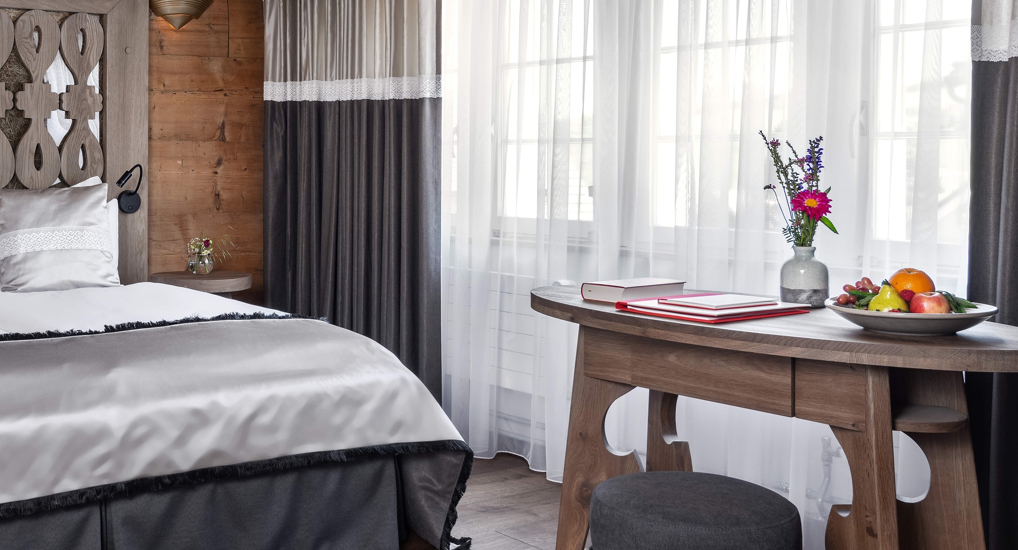 a room with a table and a bed