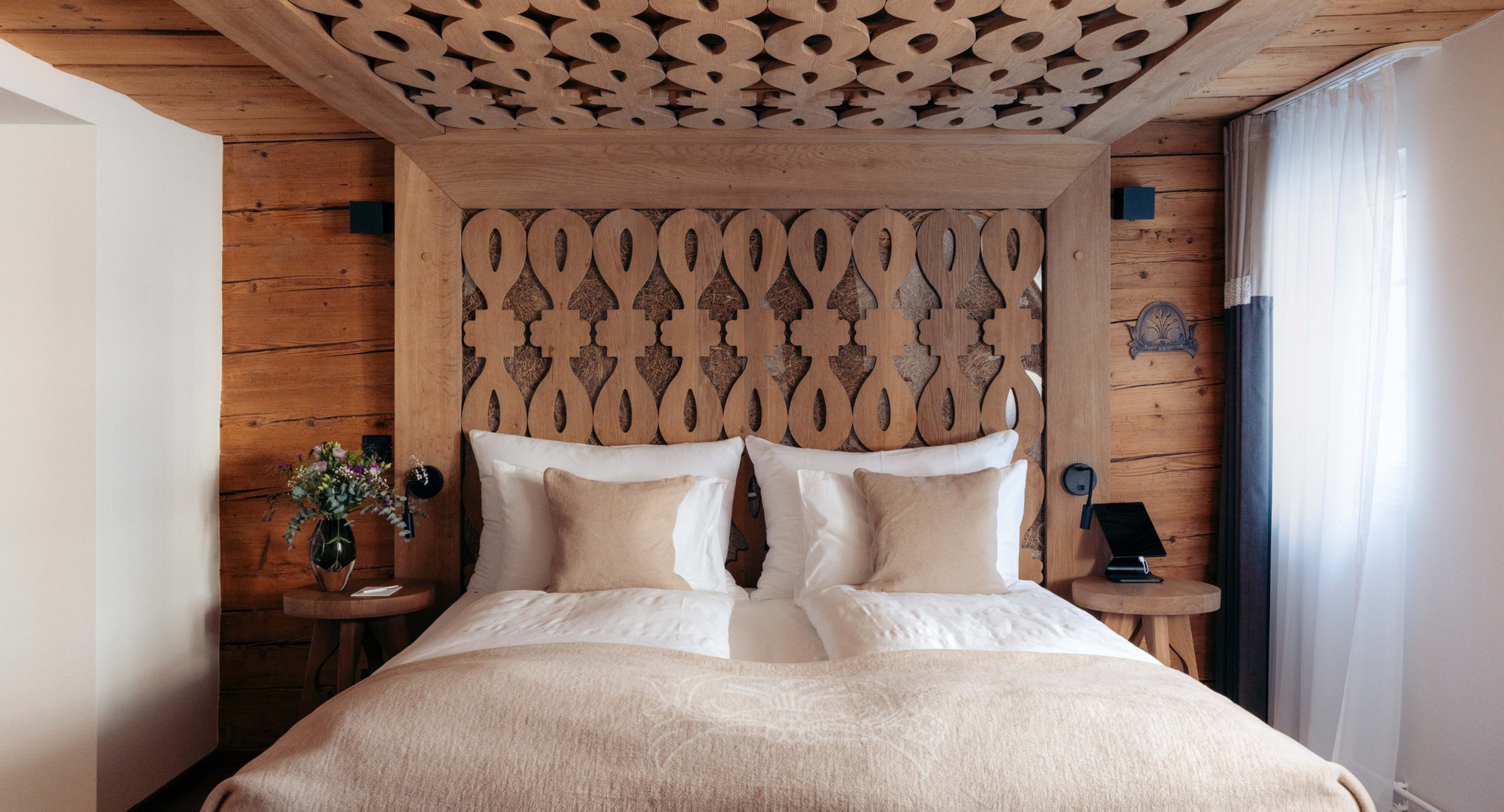 a bed with a wooden headboard