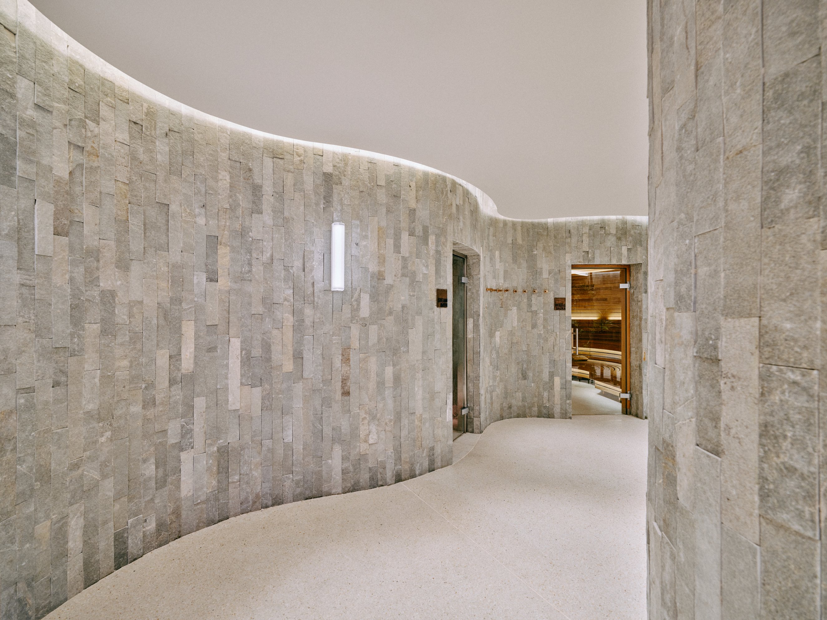 a stone wall with a curved wall