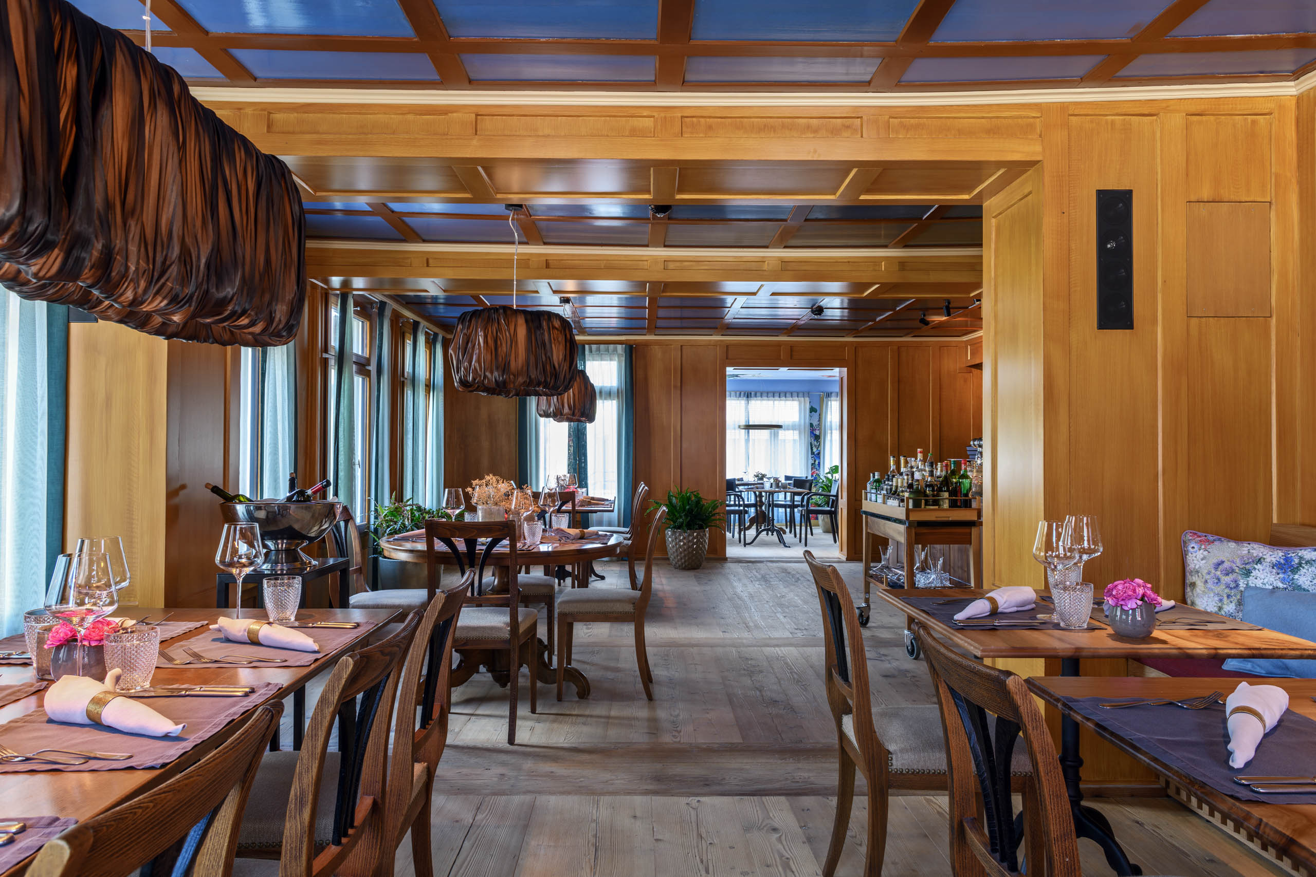 a restaurant with tables and chairs