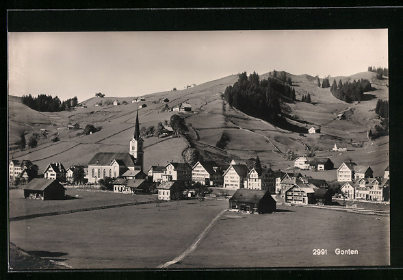 a black and white photo of a village