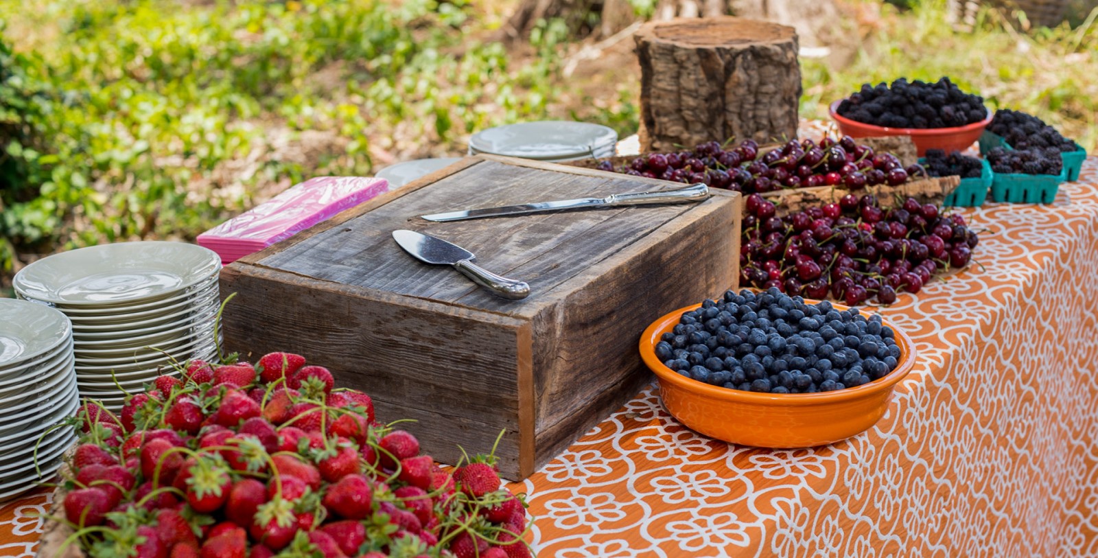 a table with fruit and a box