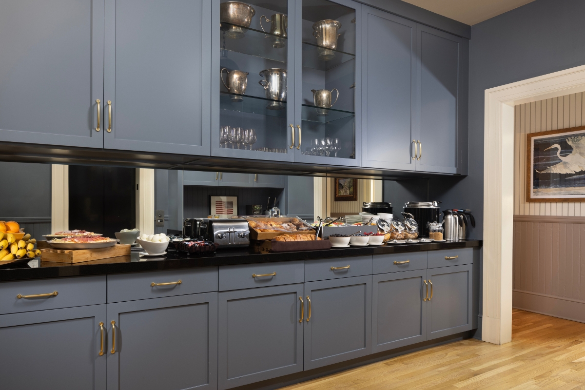 a kitchen with a counter top and glass cabinets