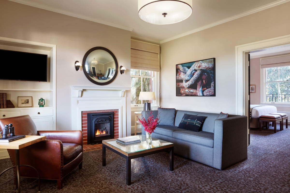 a living room with a fireplace and a couch