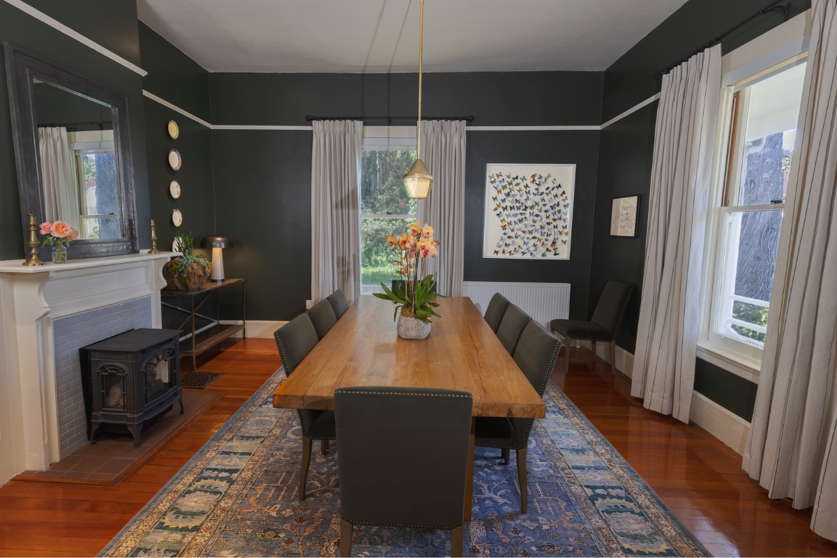 a dining room with a table and chairs
