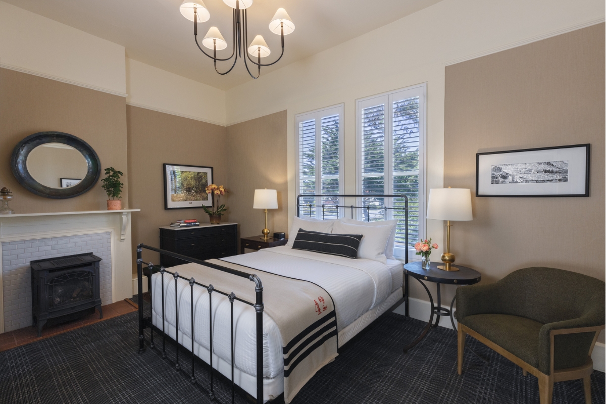 a bedroom with a bed and a fireplace