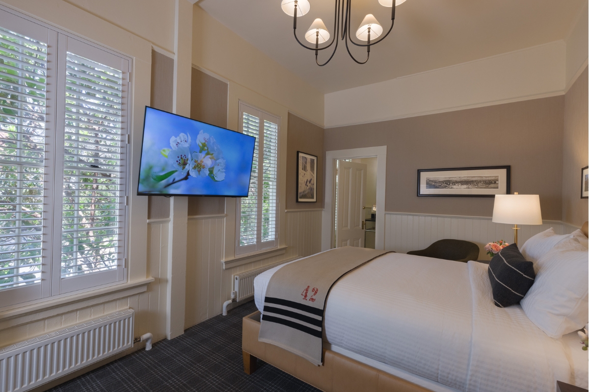 a room with a television and a bed