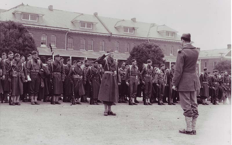 a man standing in front of a group of soldiers