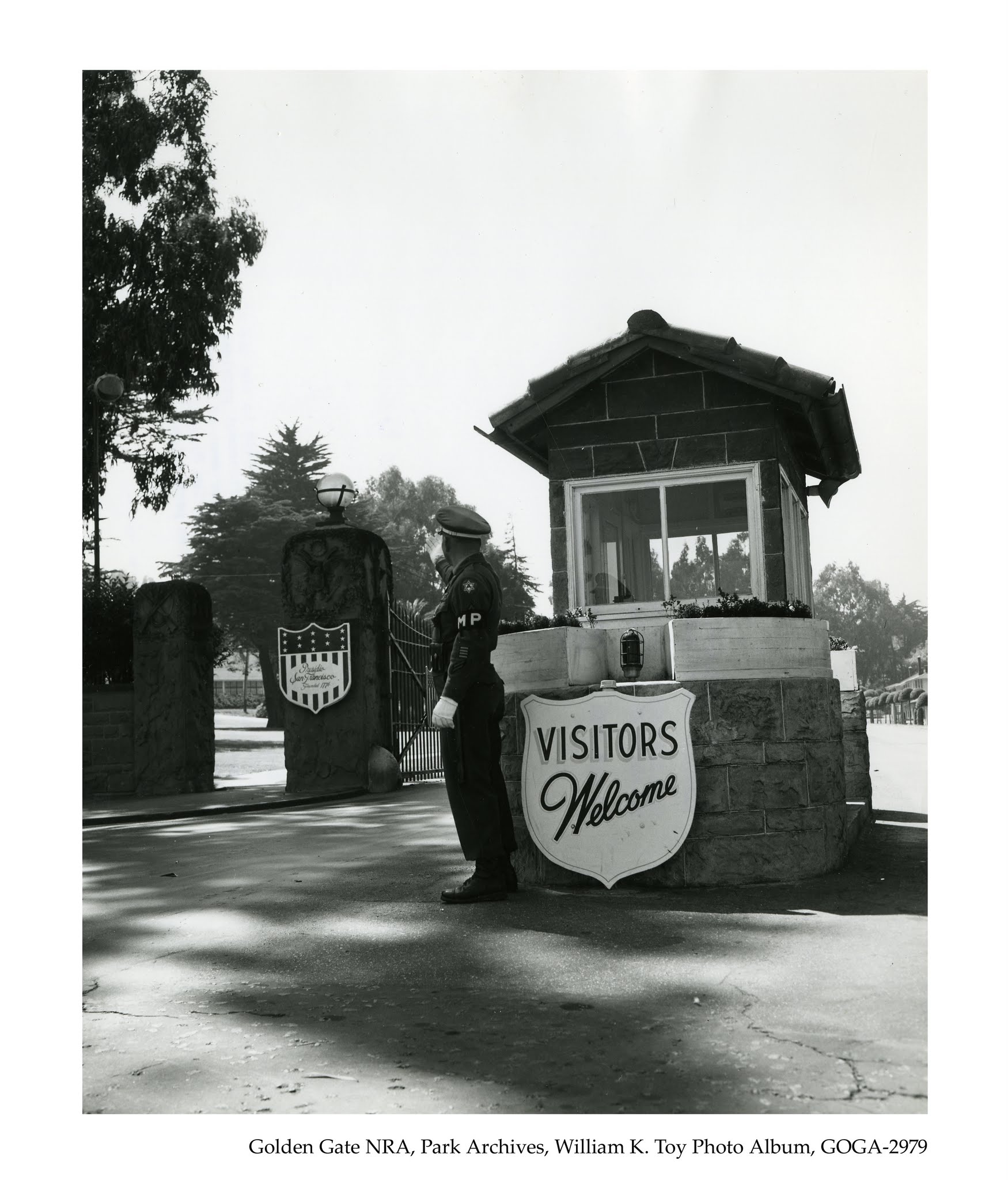 a man standing in front of a welcome sign