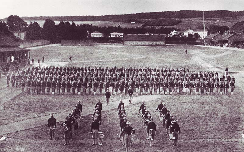 a group of soldiers marching in a field