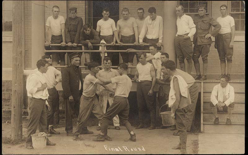 a group of men standing around each other