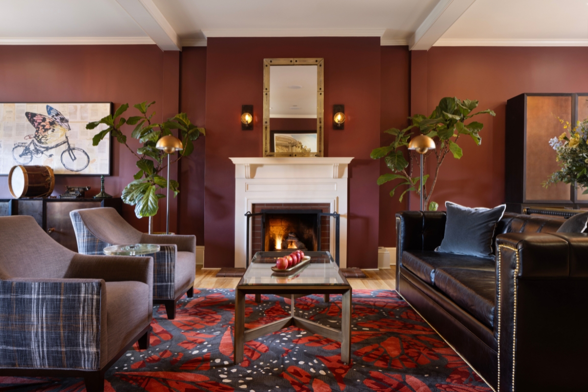 a living room with a fireplace and couches