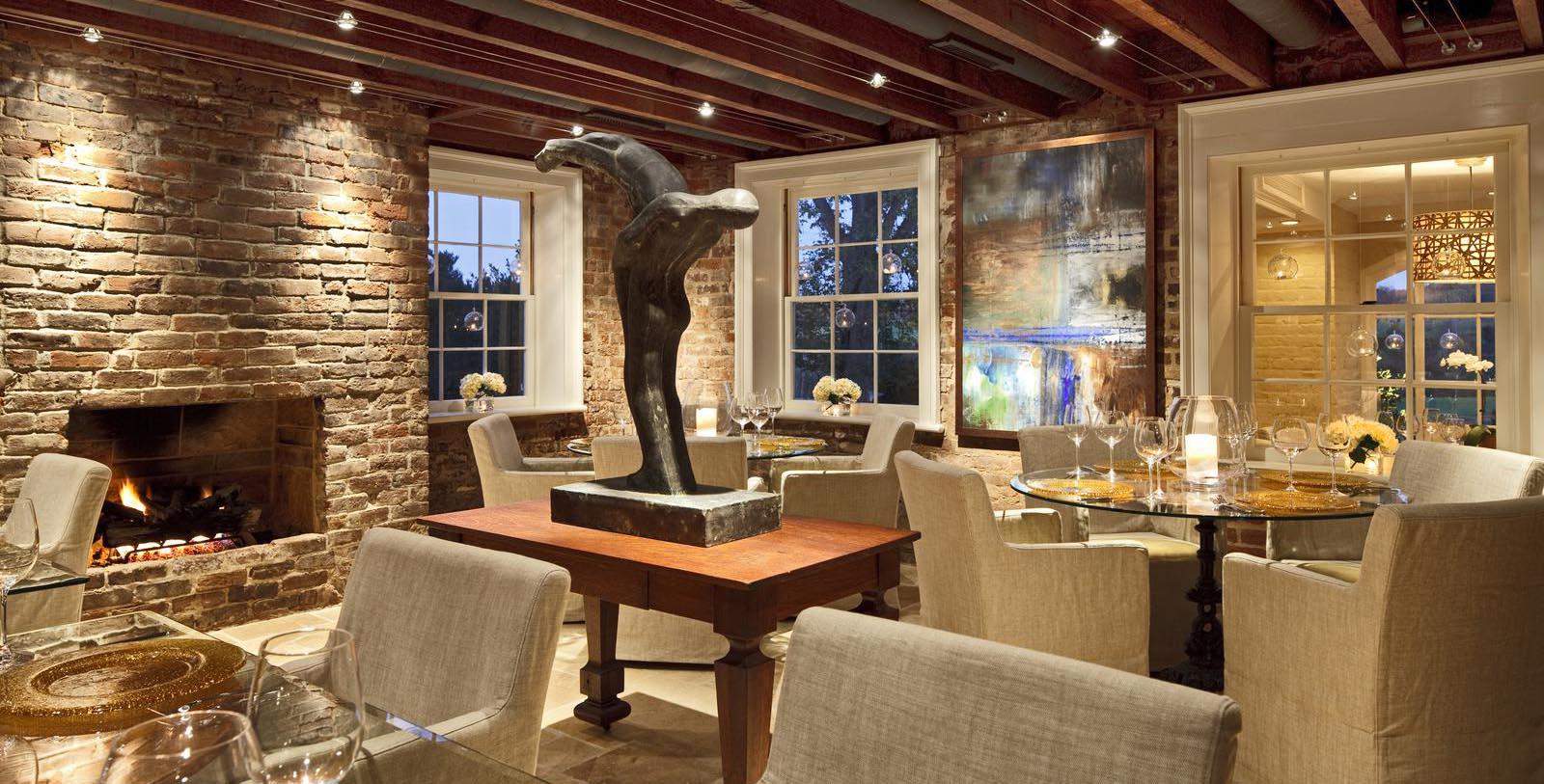 a room with a sculpture and chairs