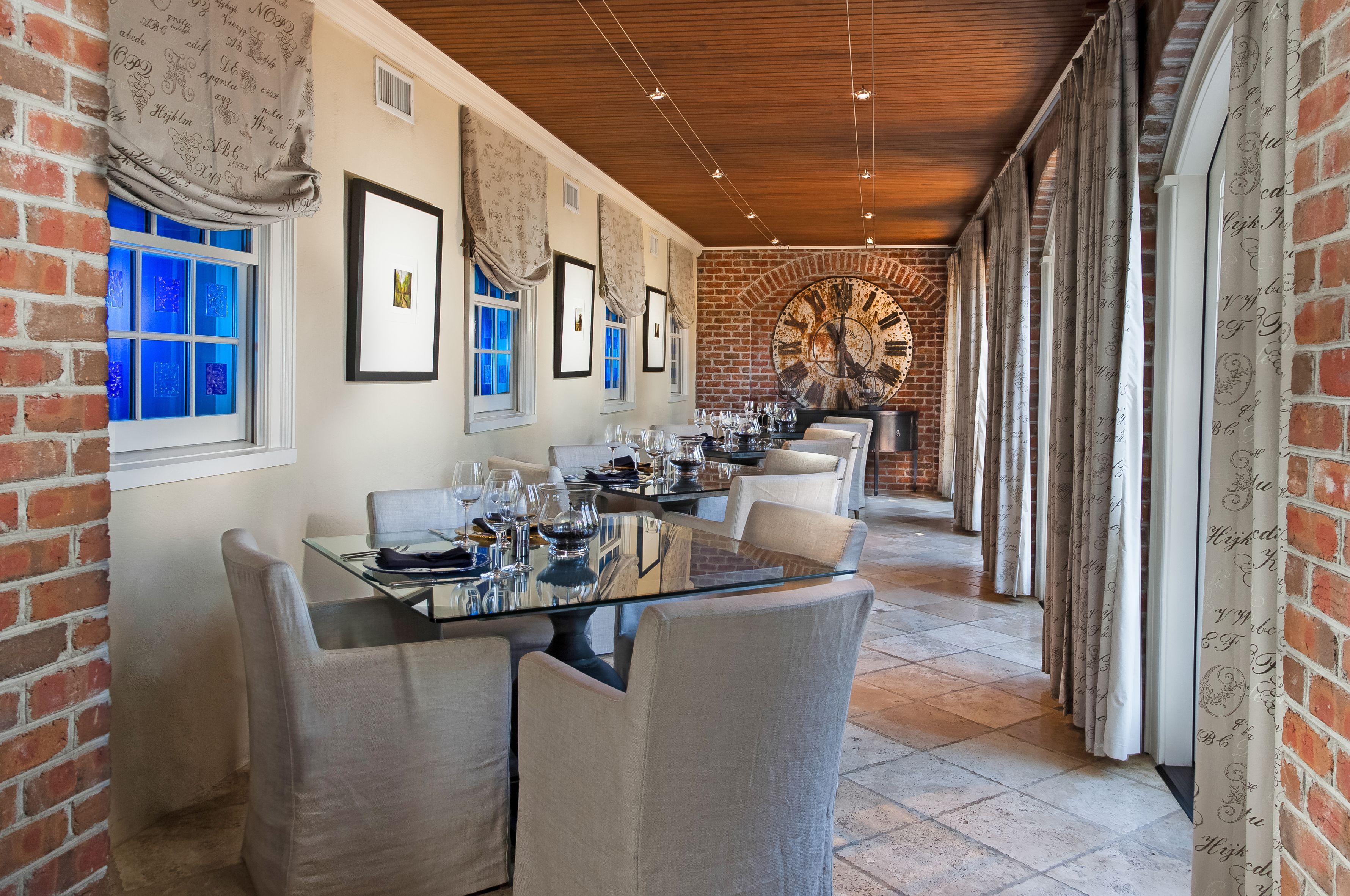a room with a large clock and tables