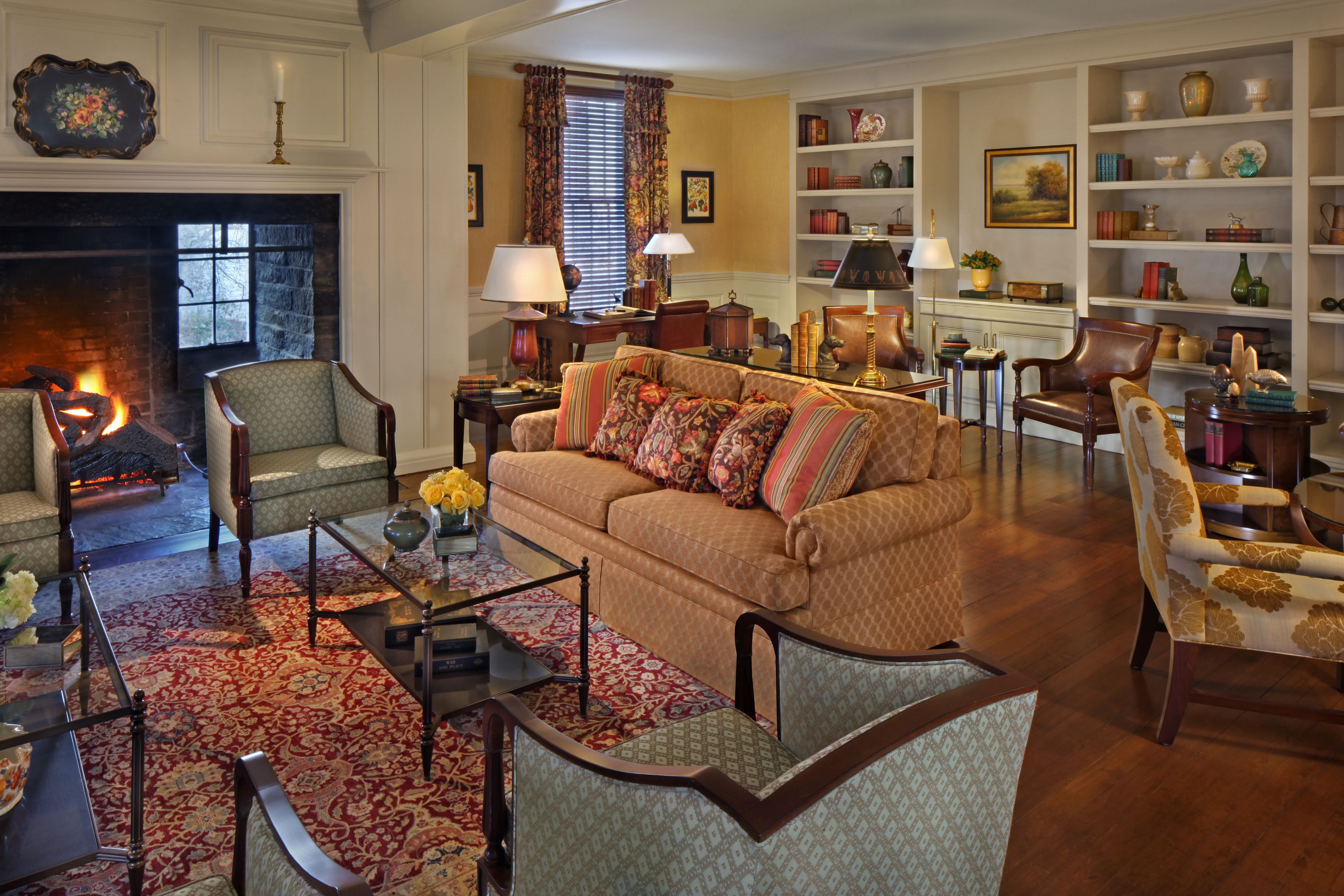 a living room with a fireplace and couches