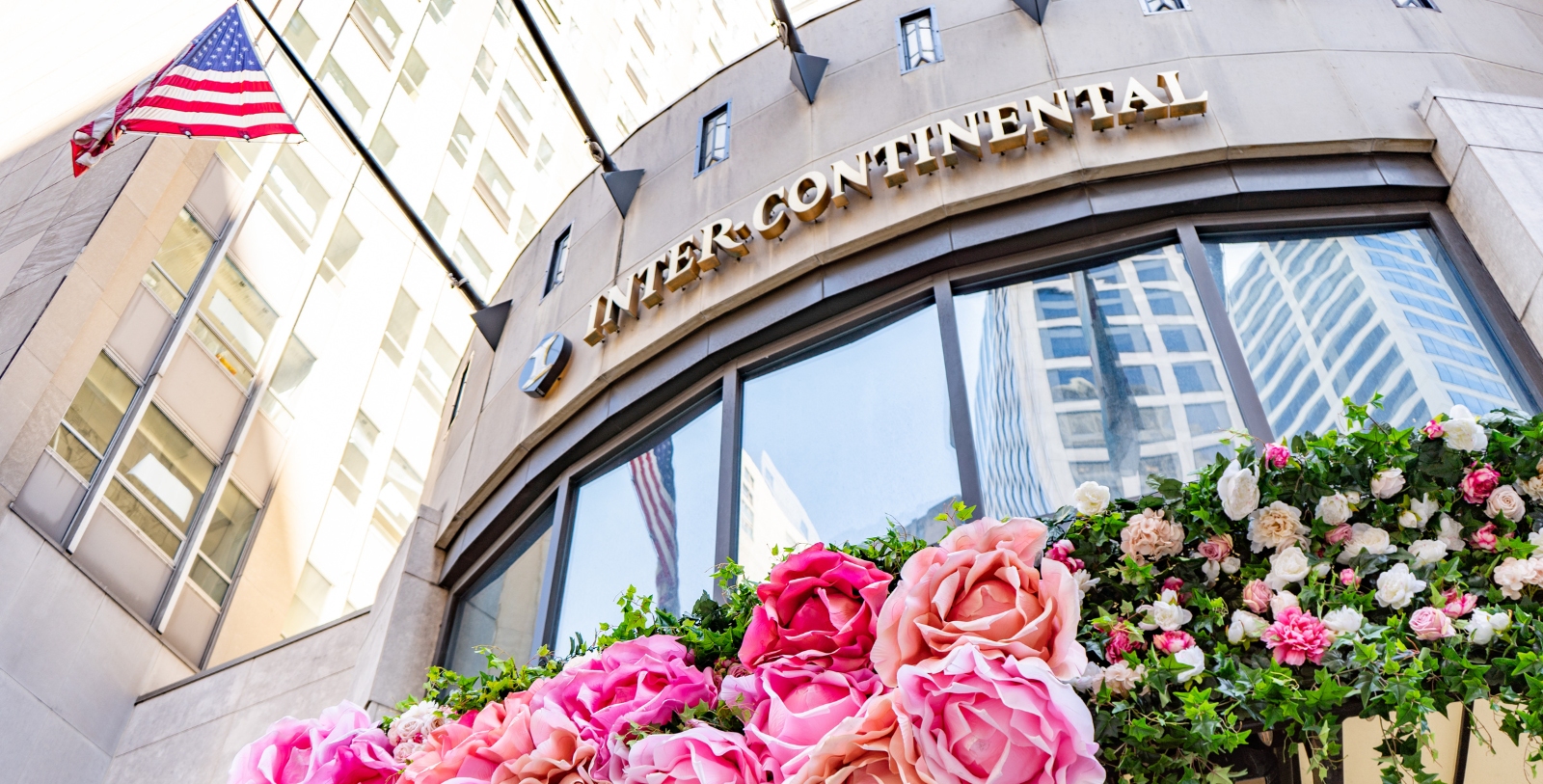 a building with flowers on the side
