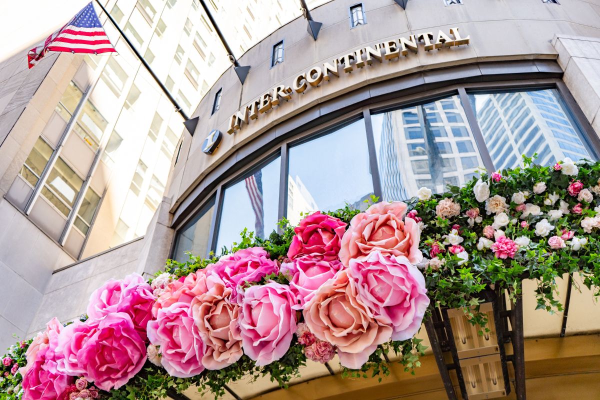 a building with flowers on the front