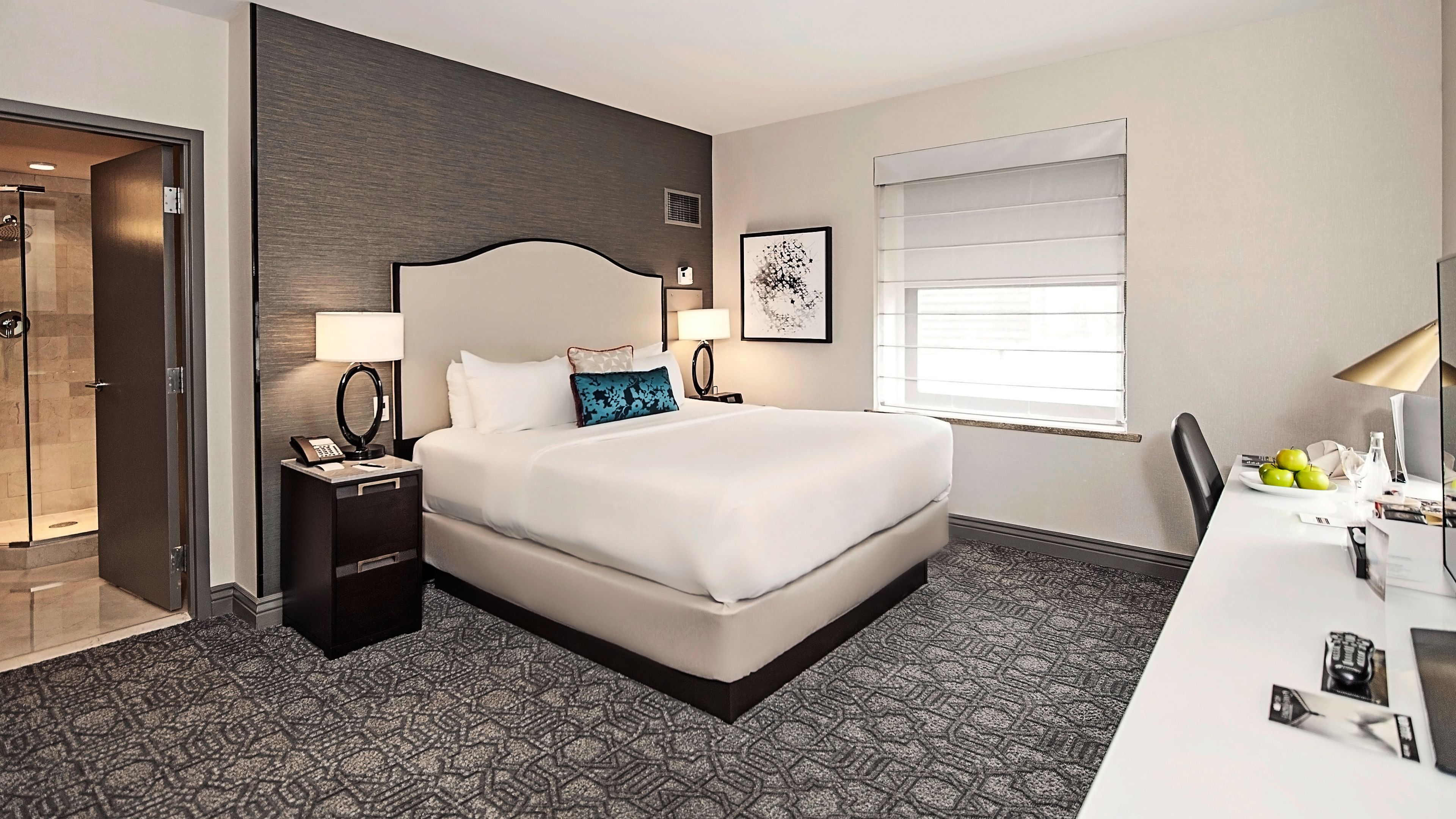 a bed with a lamp on the side
