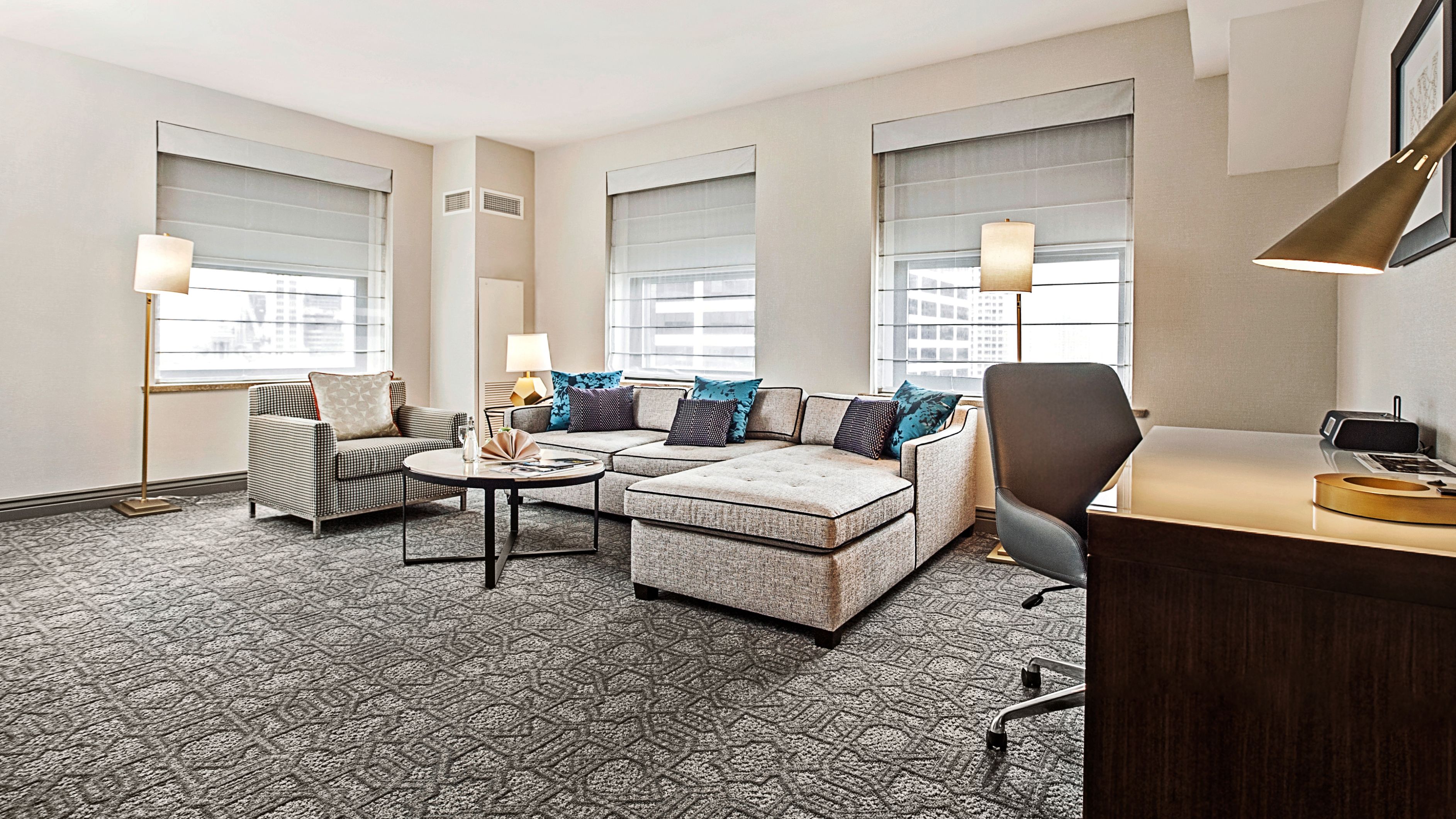 a room with a couch and a desk