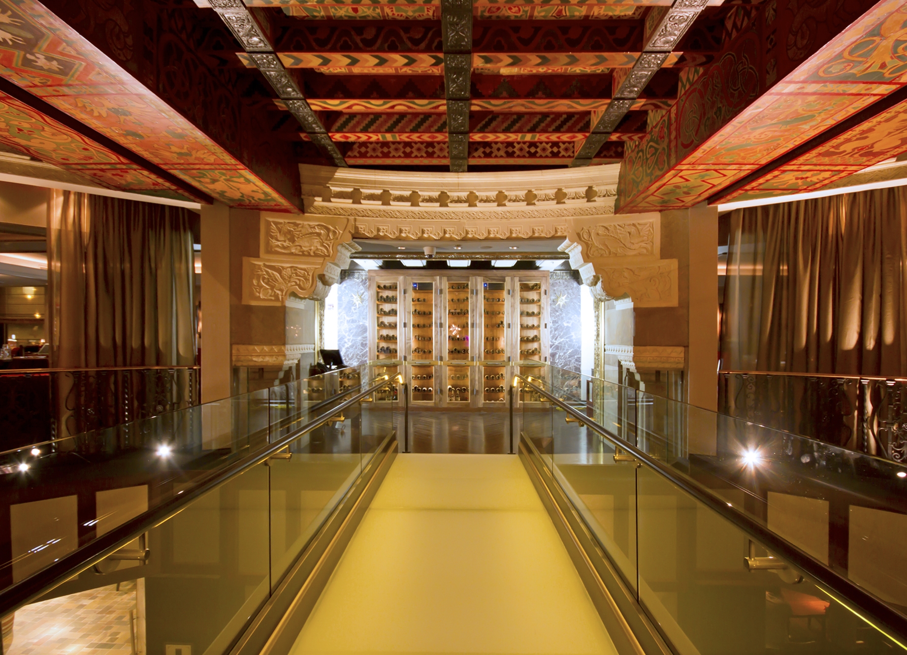 a glass walkway in a building