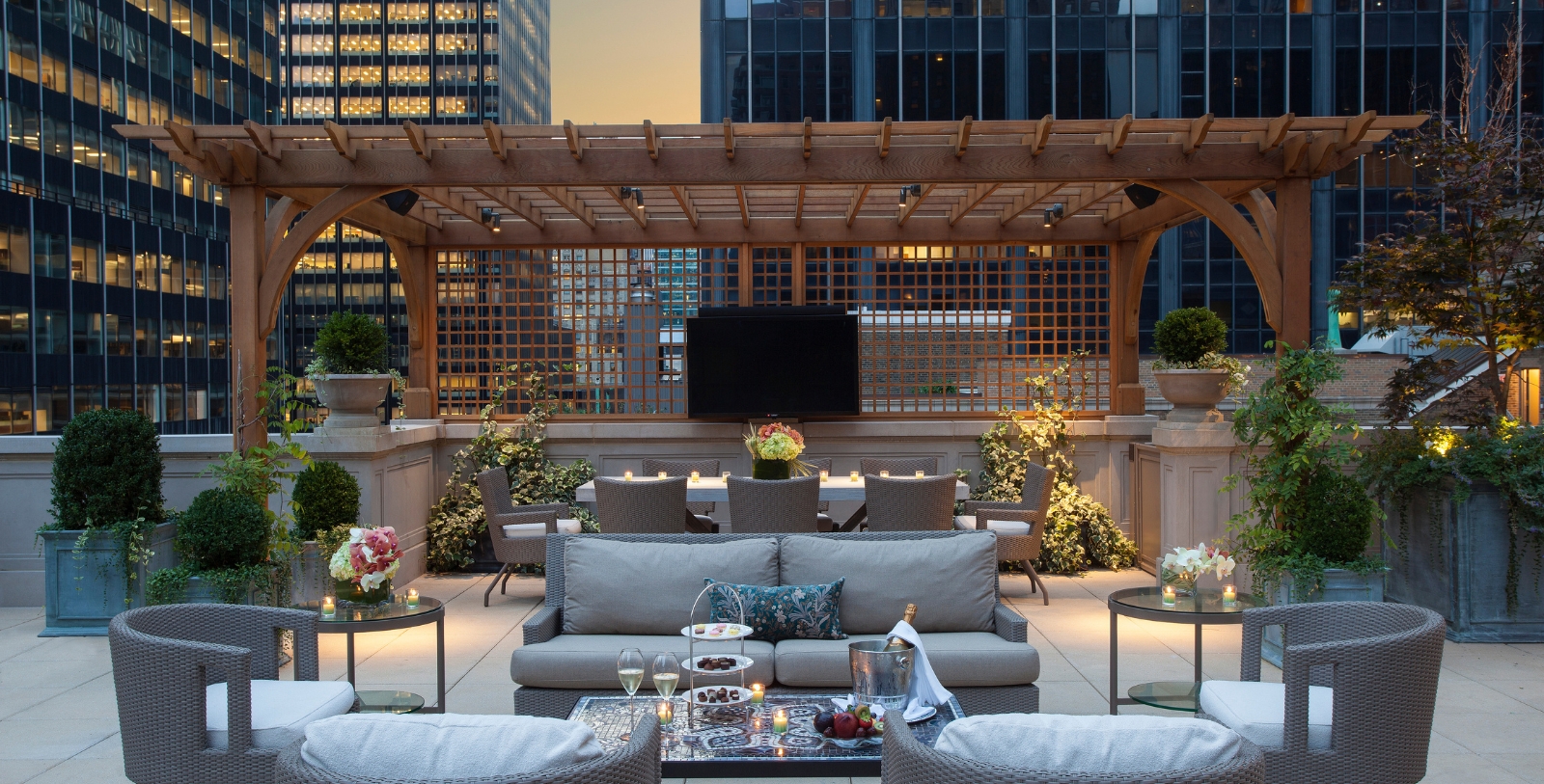 a patio area with a television and a table
